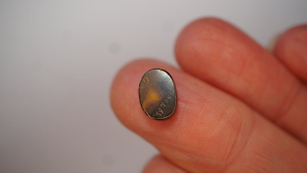 2.3ct Boulder Opal - Crimson Play on Pale Purple Host Body Tone
