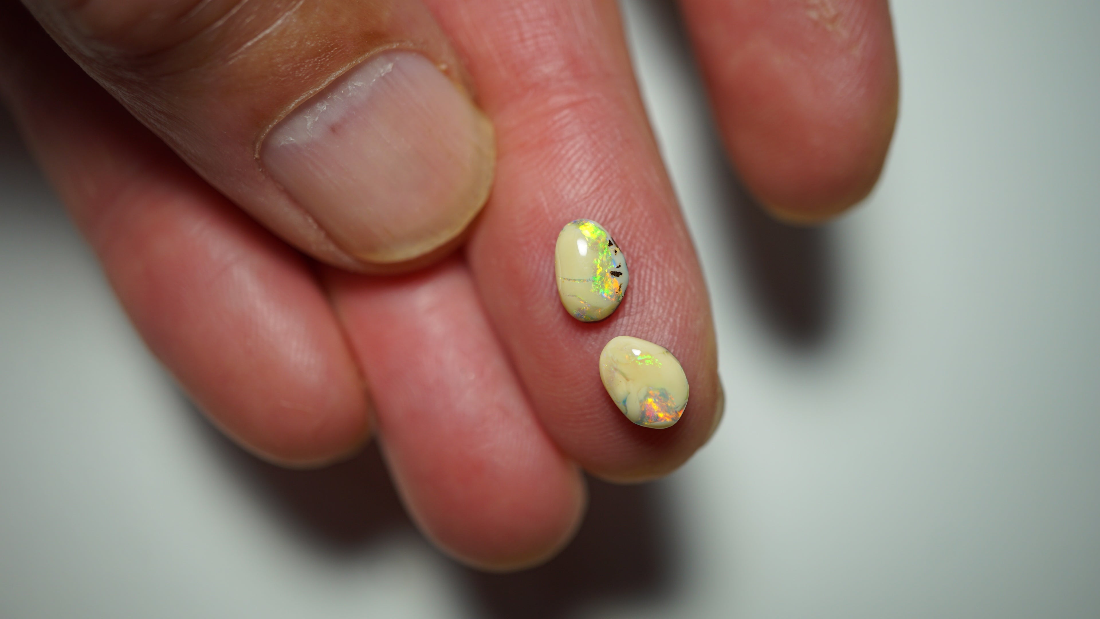 2.3ct Matched Boulder Opal Pair - Green & Aqua Play with Blue and Yellow Highlights on Brown Host Body Tone