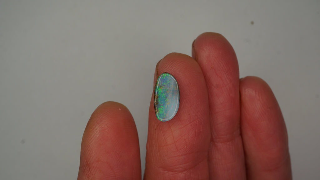 2.6ct Boulder Opal - Green, Blue & Crimson Play on Pale Purple Host Body Tone