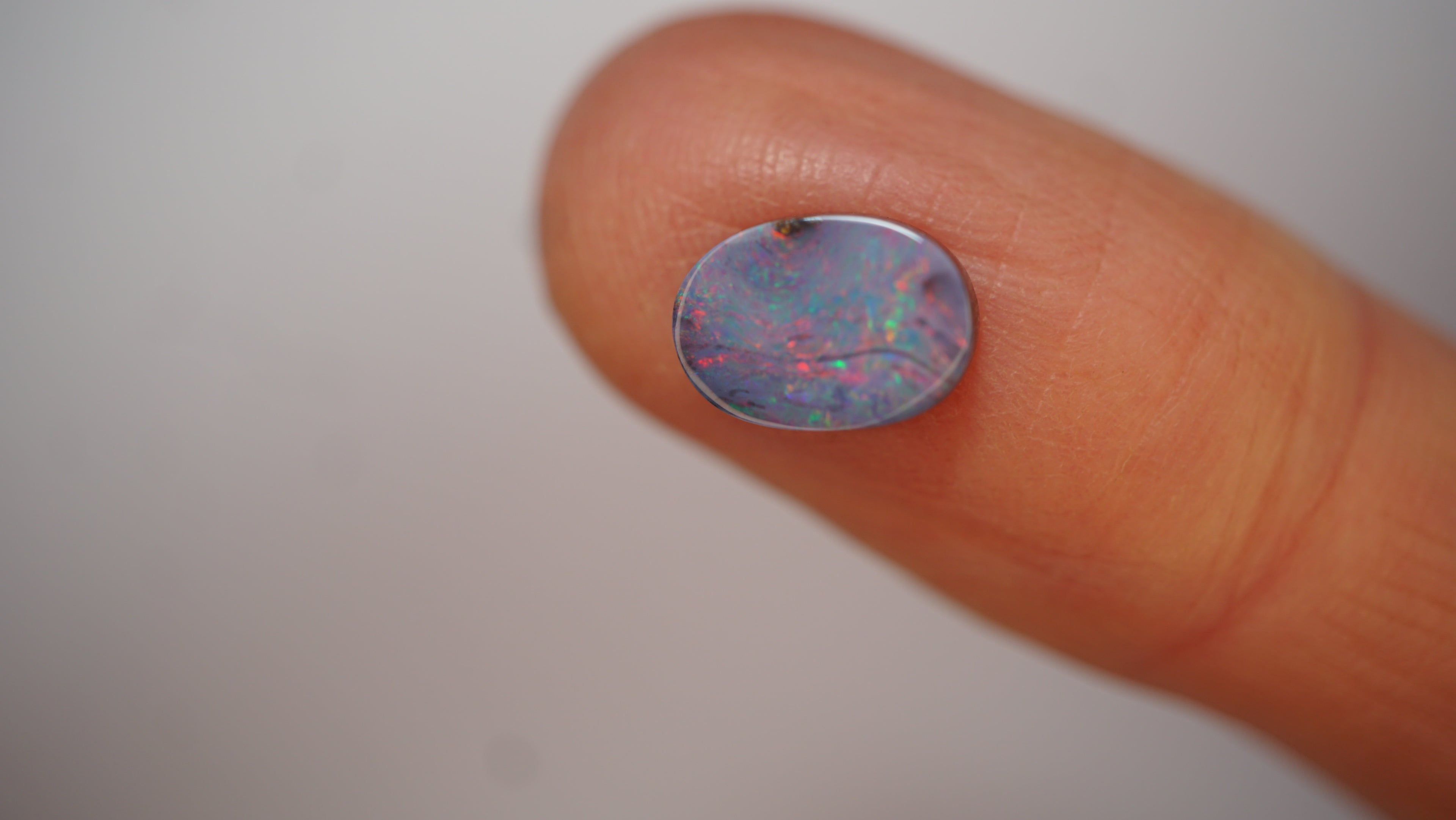 2.3ct Boulder Opal - Crimson Play on Pale Purple Host Body Tone