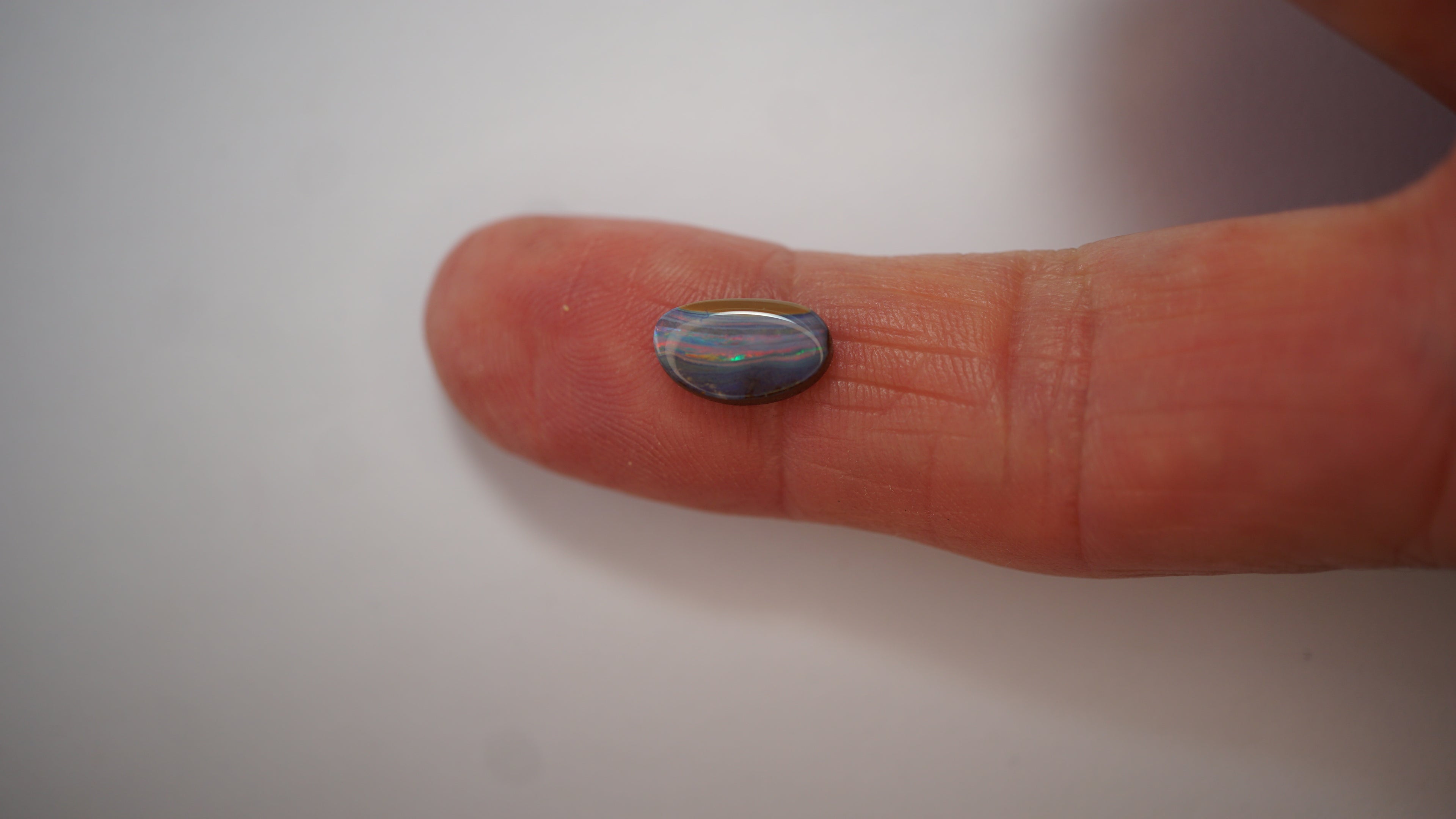 2.1ct Boulder Opal - Crimson & Green Play on Purple Host Body Tone