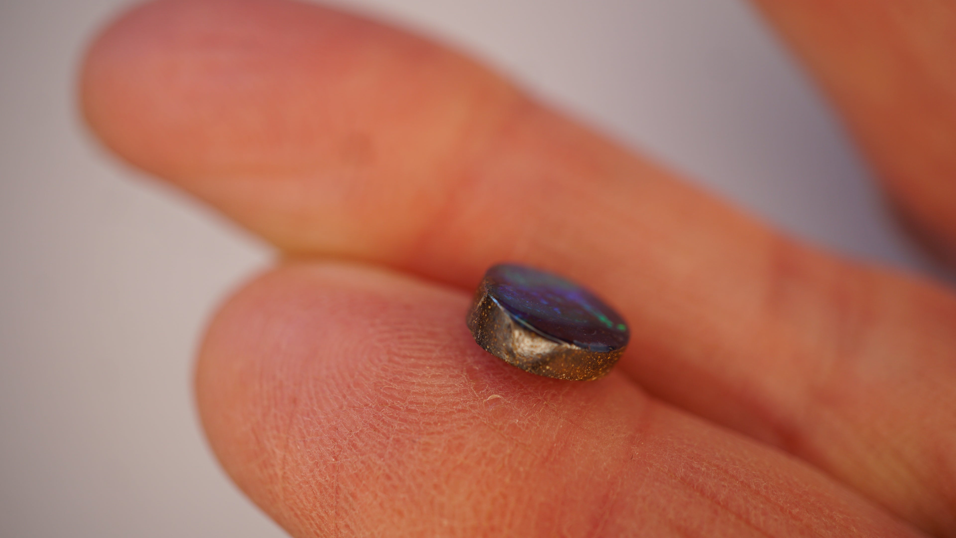 2.2ct Boulder Opal - Green Play on Deep Blue Host Body Tone