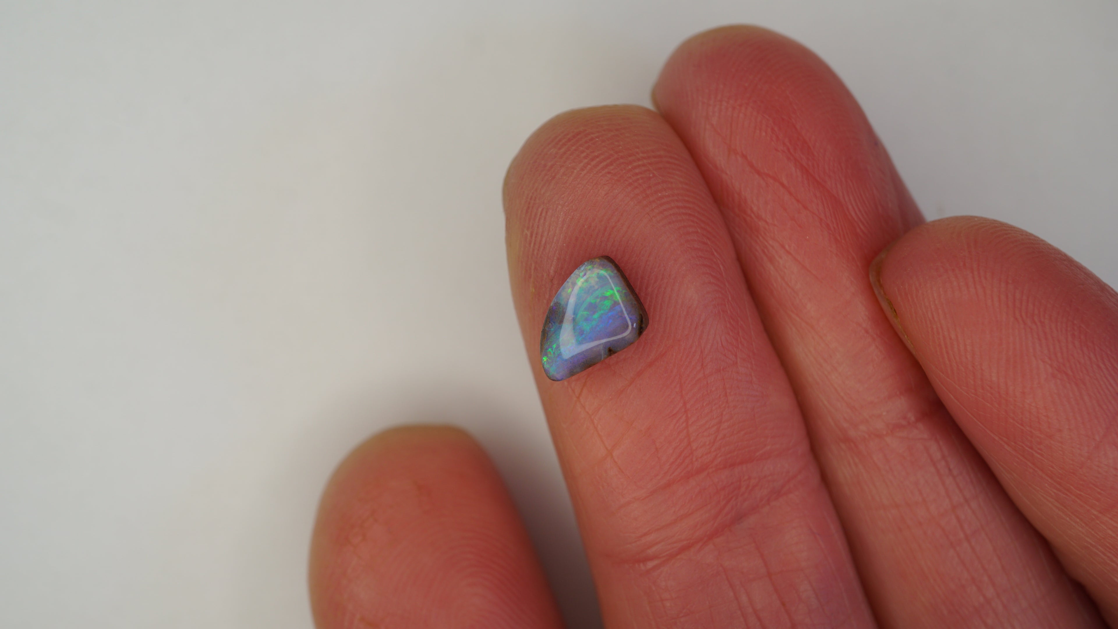 1.3ct Boulder Opal - Bright Green Play on Purple Host Body Tone