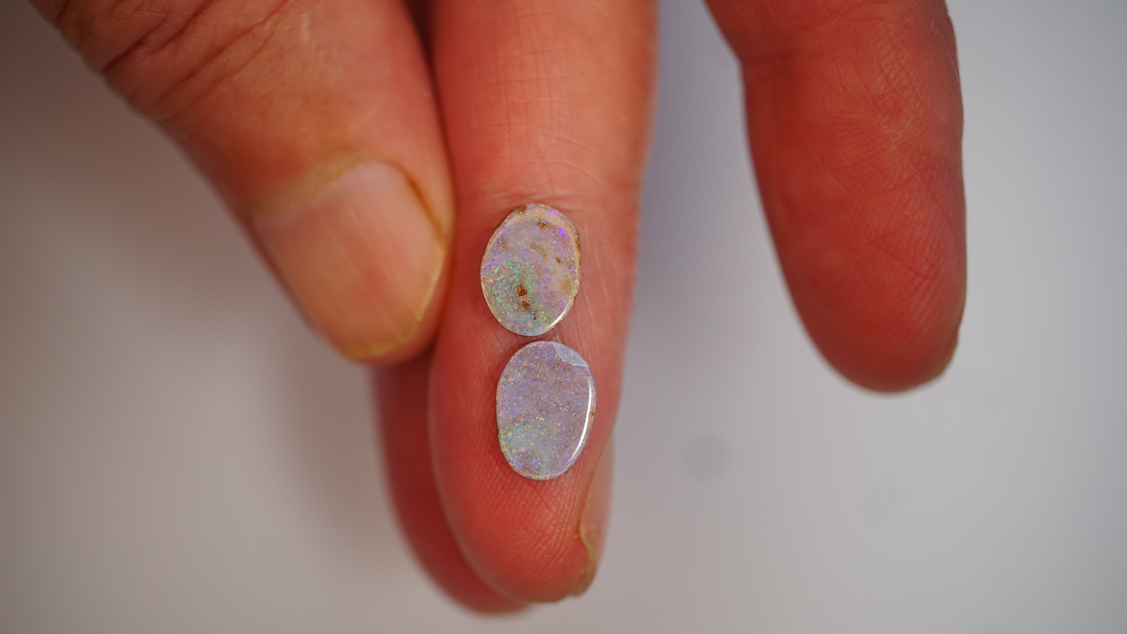 2.75ct Pale Purple Boulder Opal Pair - Green & Magenta Pinfire