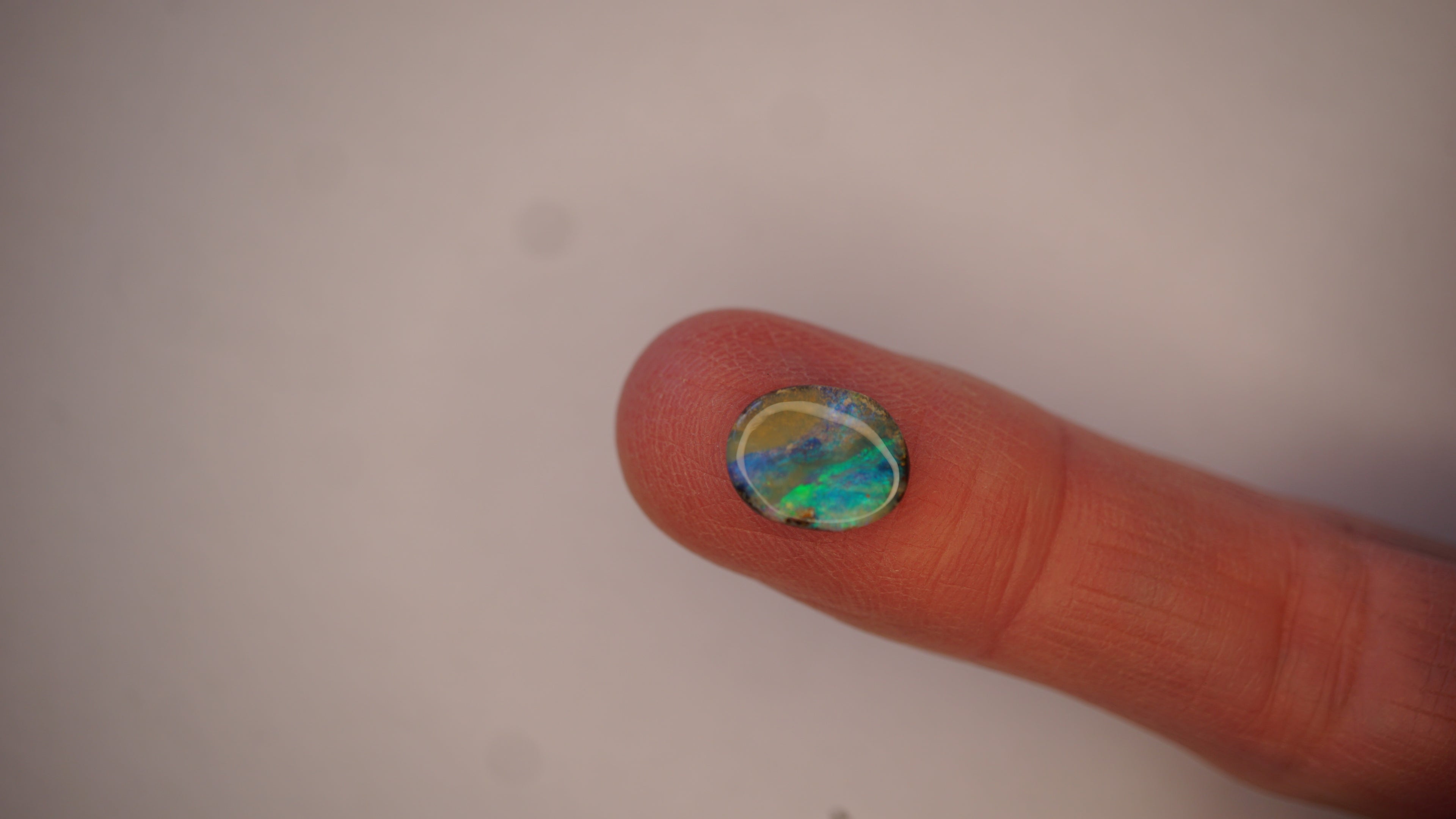 2.5ct Boulder Opal - Electric Green Sash on Blue Base