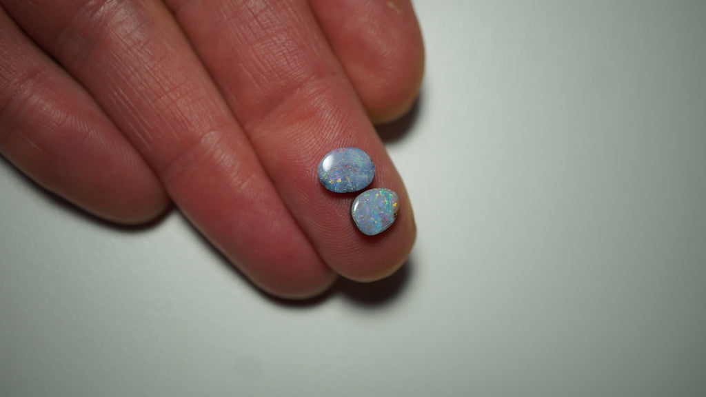 2.45ct Matched Boulder Opal Pair - Magenta & Green Pinfire on Pale Purple Host Body Tone