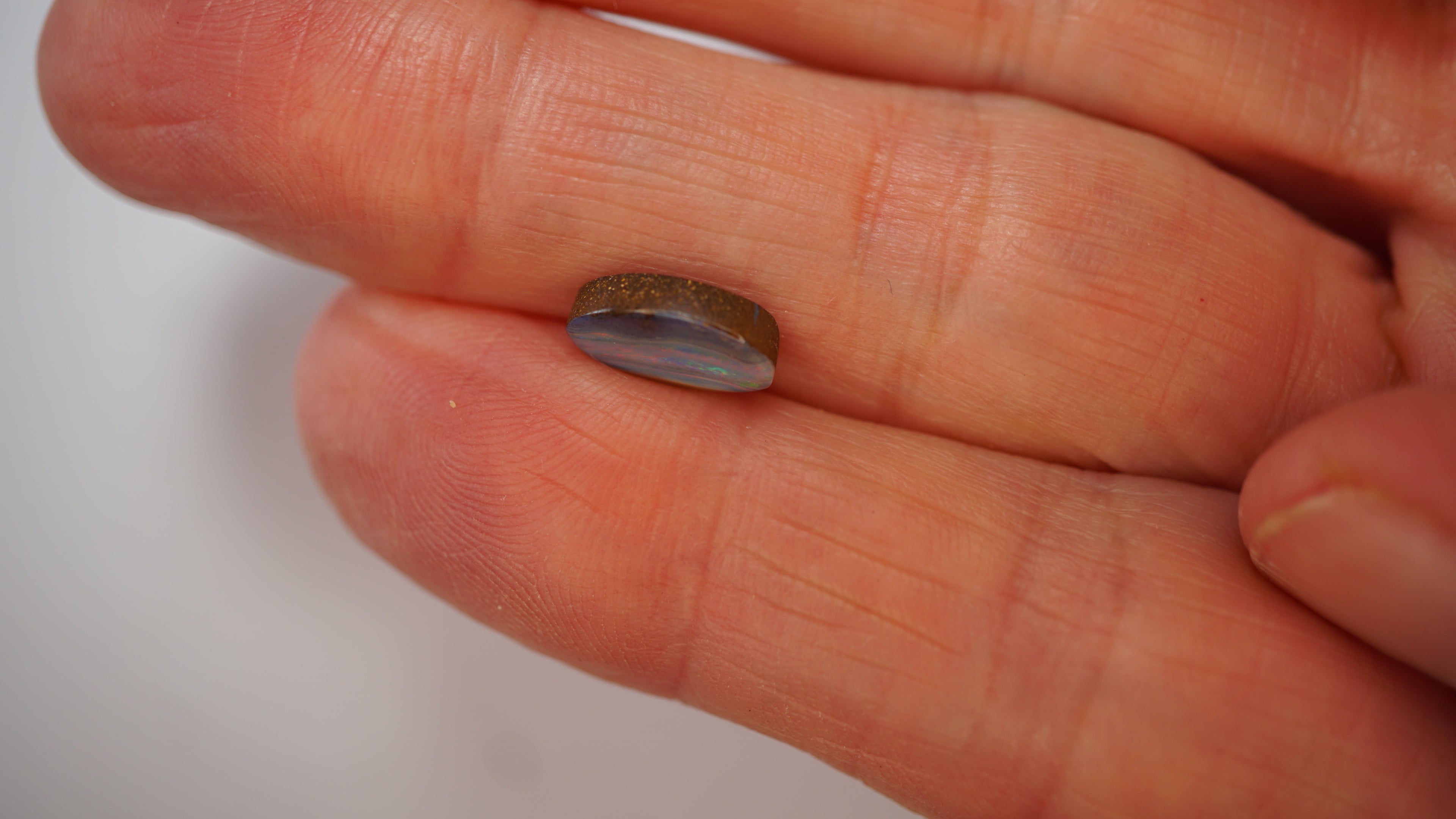 2.1ct Boulder Opal - Crimson & Green Play on Purple Host Body Tone