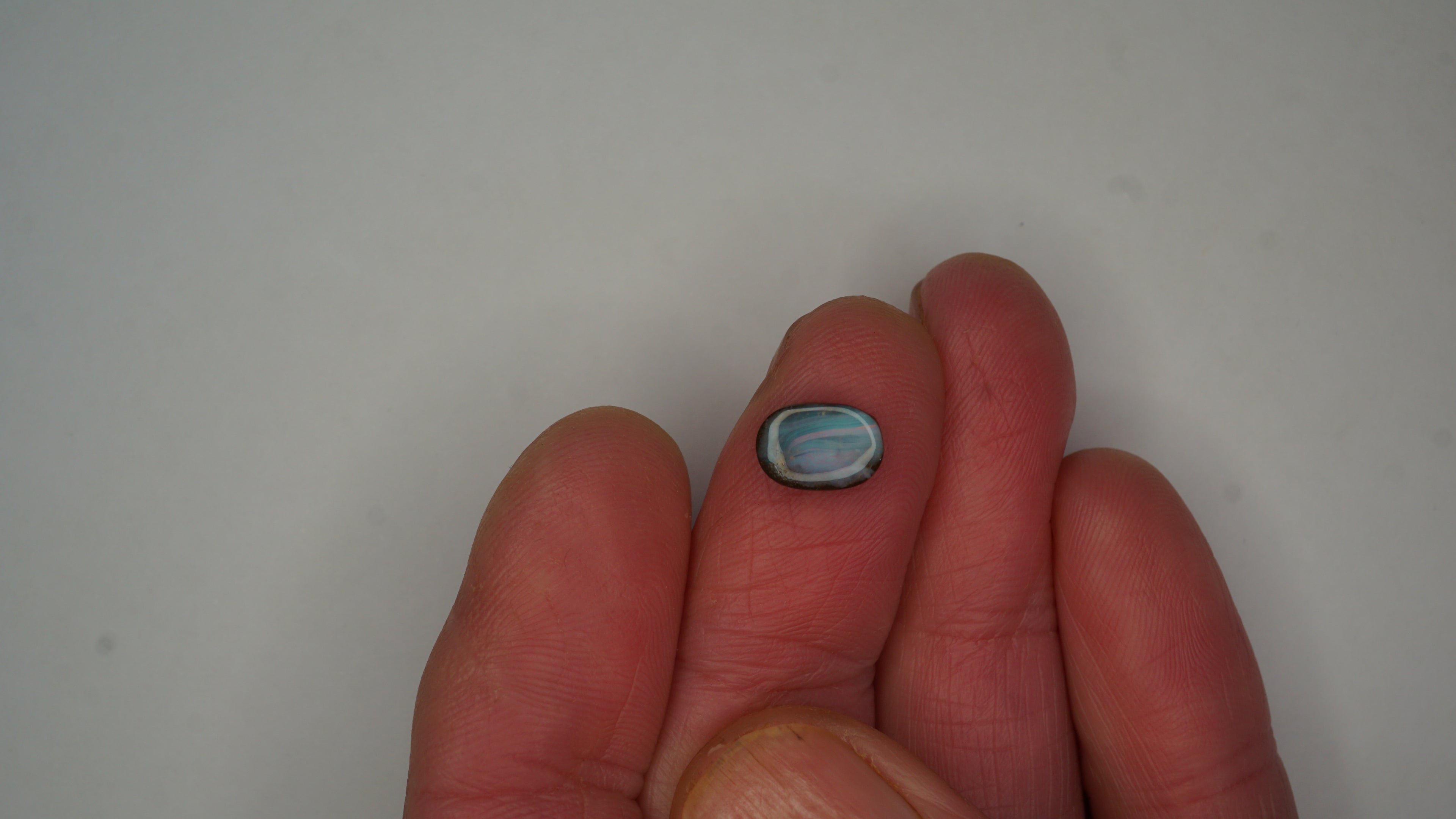 1.9ct Boulder Opal - Pink, Green & Red Pinfire on Blue-Green Host Body Tone