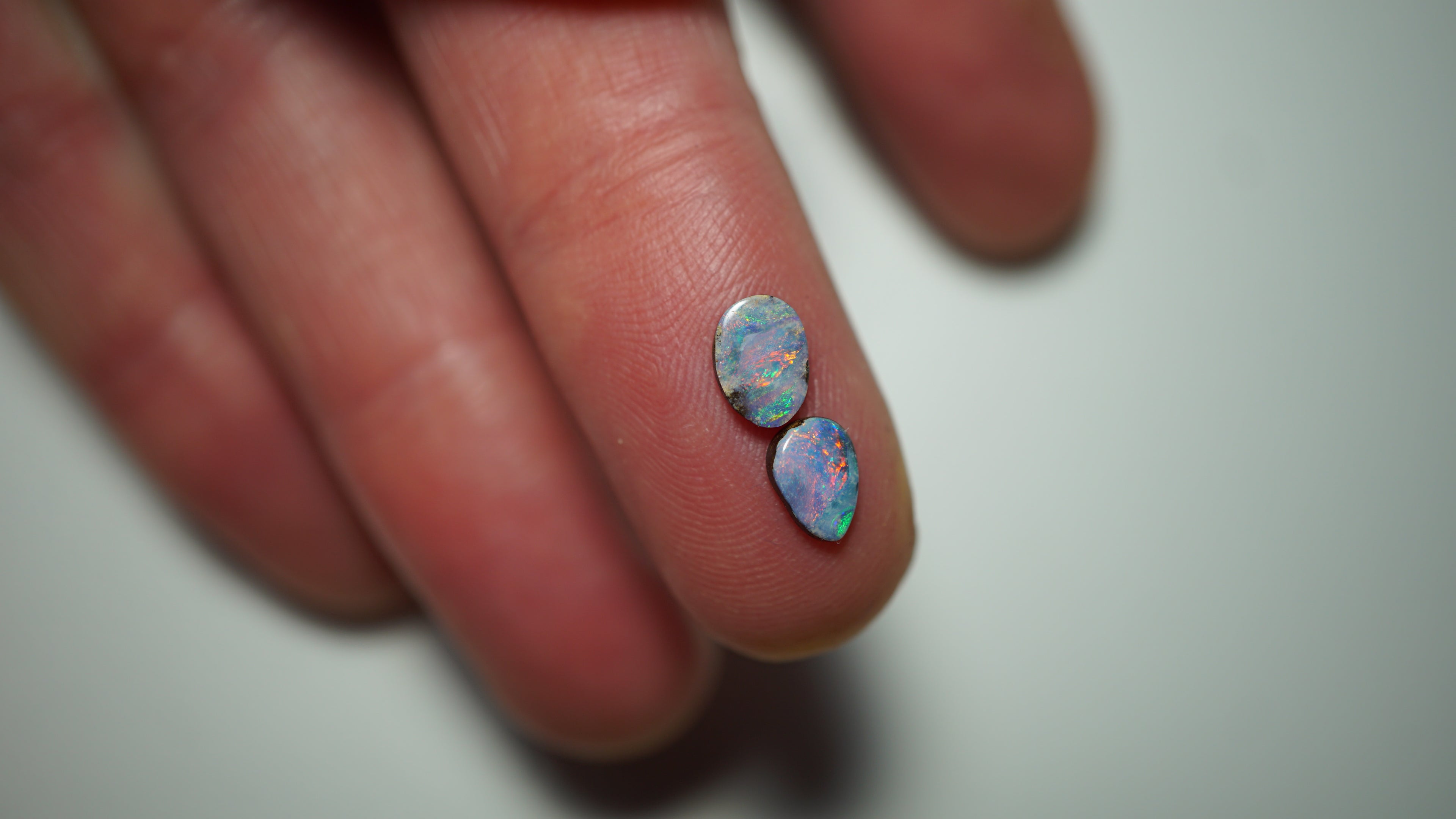 1.3ct Matched Boulder Opal Pair - Magenta & Green Pinfire on Lavender Host Body Tone