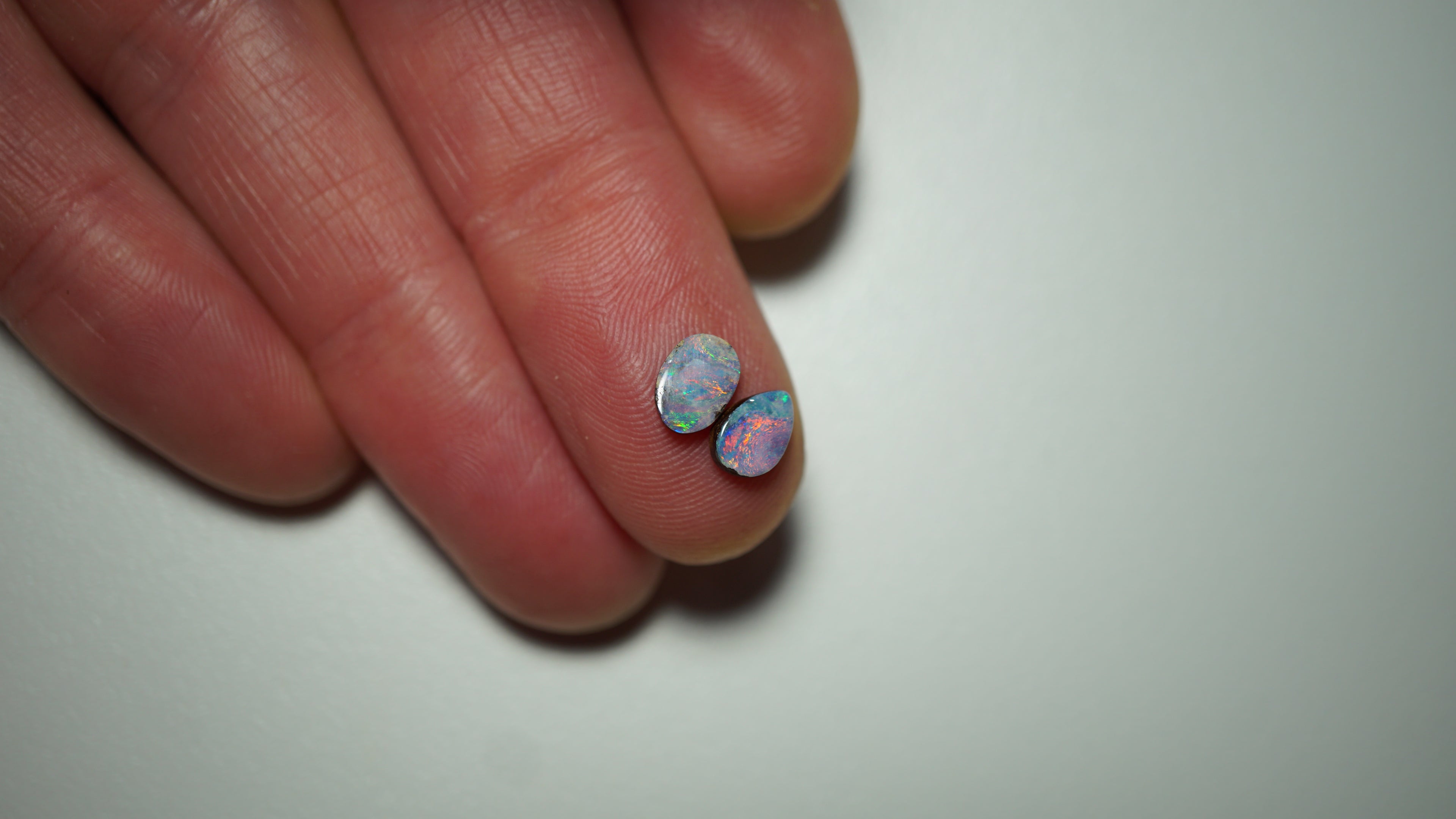 1.3ct Matched Boulder Opal Pair - Magenta & Green Pinfire on Lavender Host Body Tone