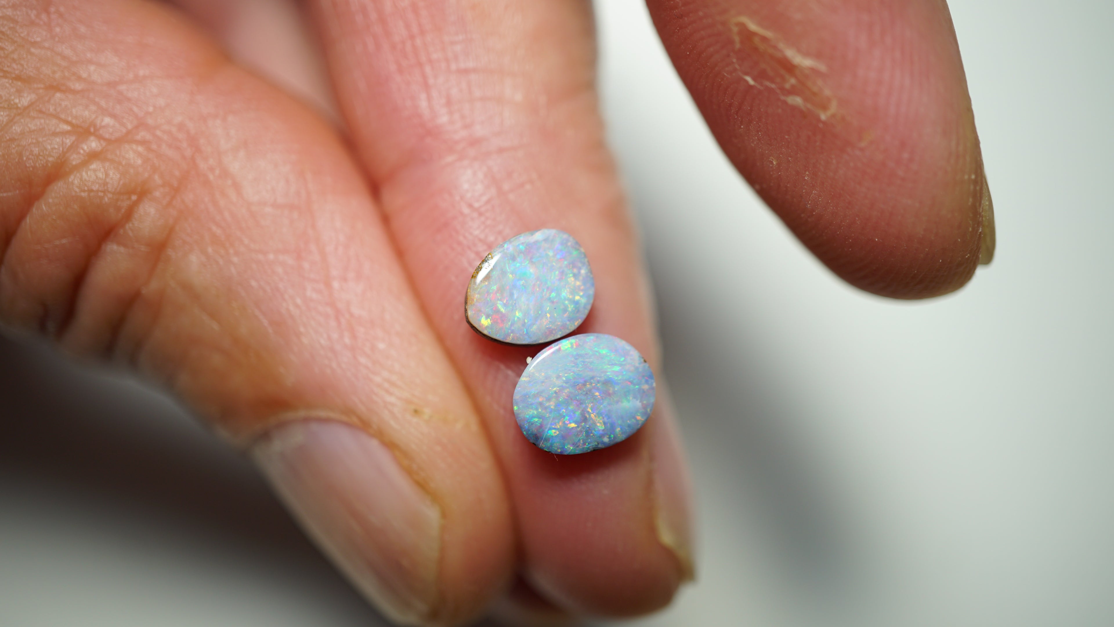 2.45ct Matched Boulder Opal Pair - Magenta & Green Pinfire on Pale Purple Host Body Tone