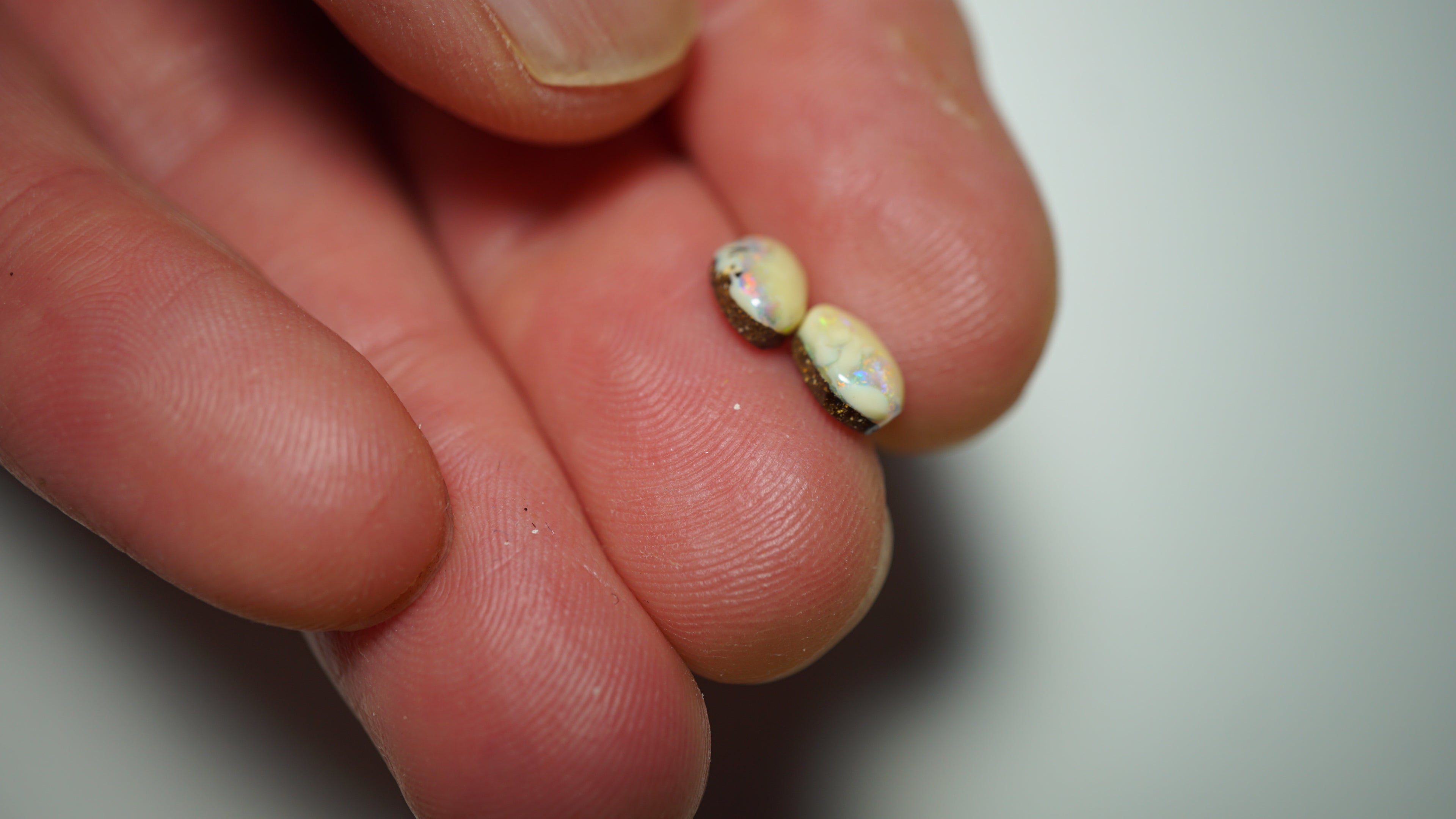 2.3ct Matched Boulder Opal Pair - Green & Aqua Play with Blue and Yellow Highlights on Brown Host Body Tone