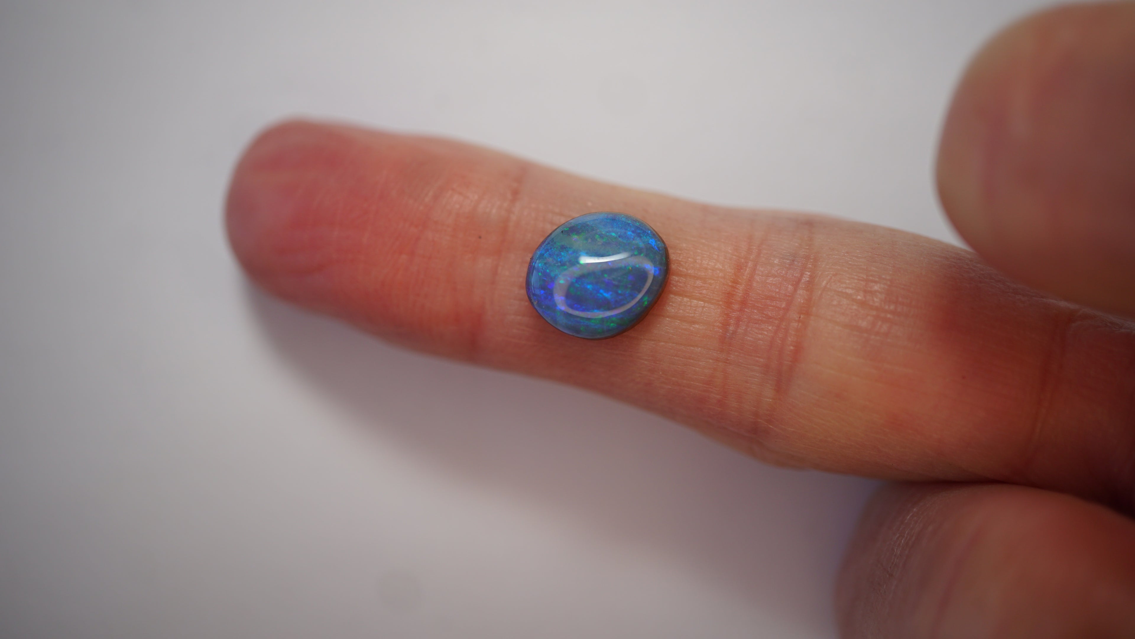 3.5ct Boulder Opal - Green & Electric Blue Fire on Blue Host Body Tone