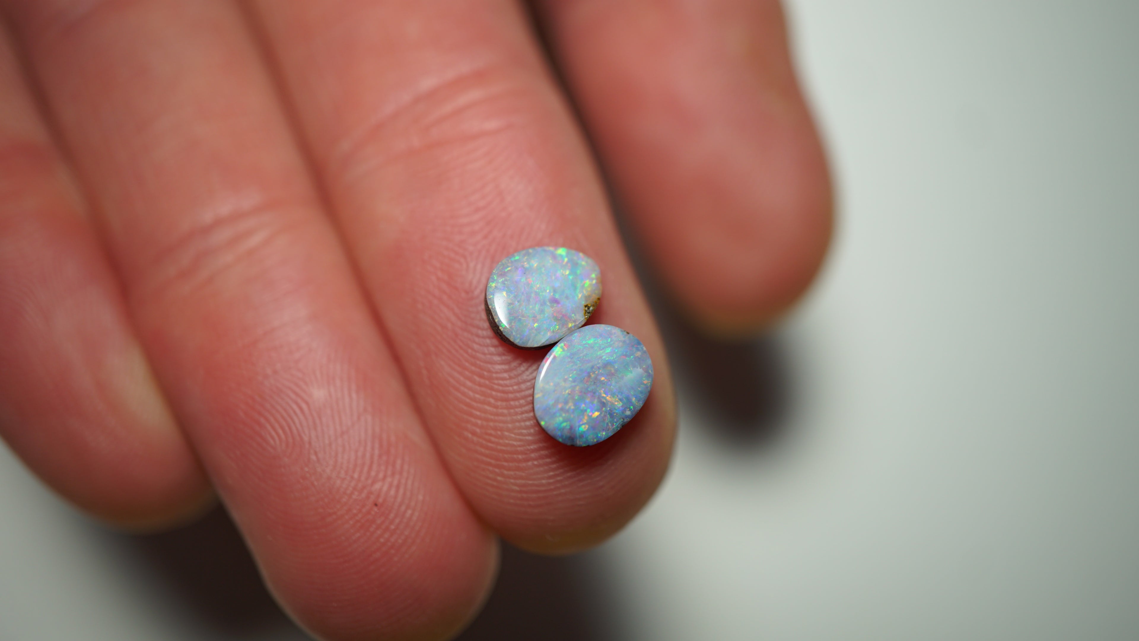 2.45ct Matched Boulder Opal Pair - Magenta & Green Pinfire on Pale Purple Host Body Tone