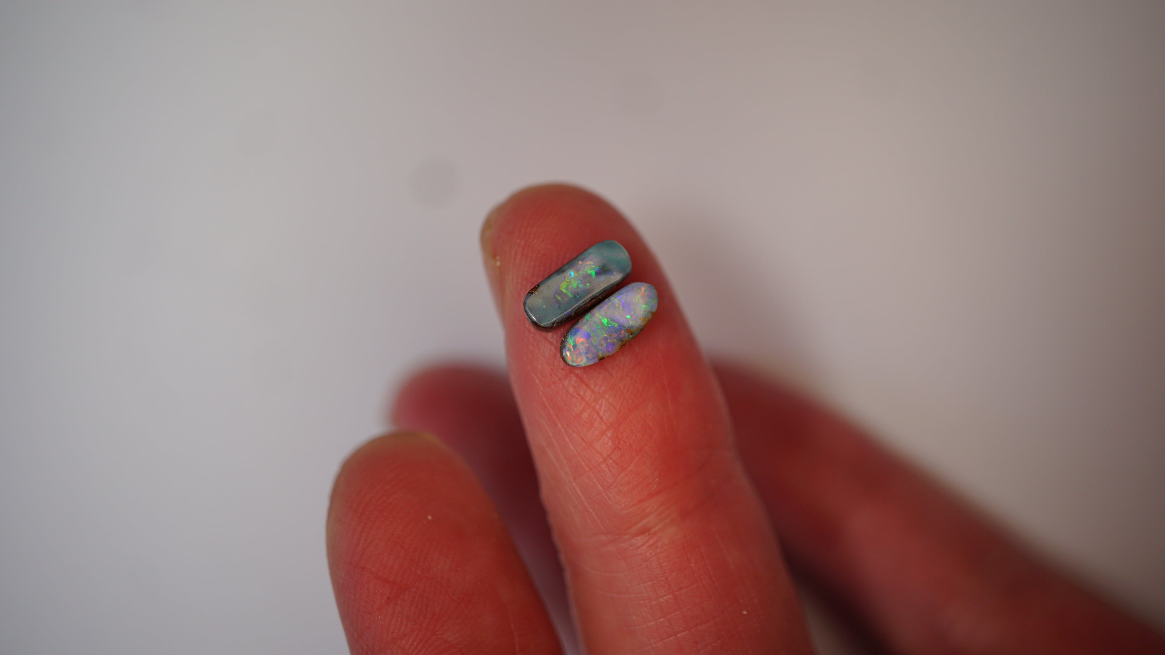 2.09ct Matched Boulder Opal Pair - Green & Violet Play on Sky Blue Host Body Tone