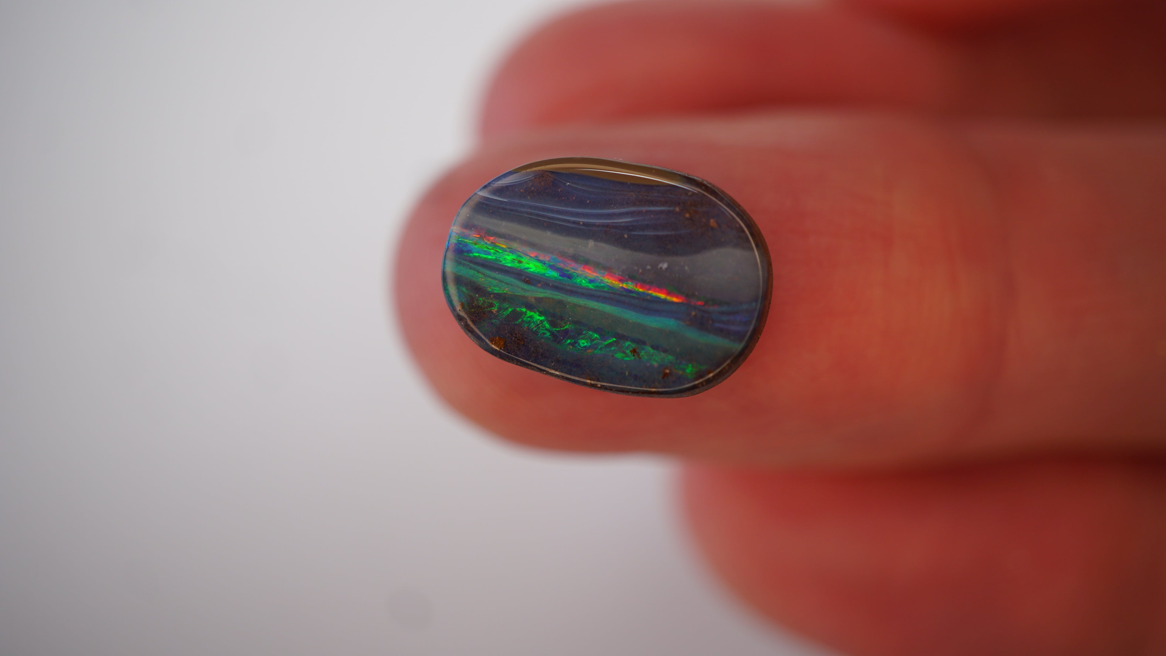 5.4ct Boulder Opal - Neon Green & Crimson Streaks on Blue Host Body Tone