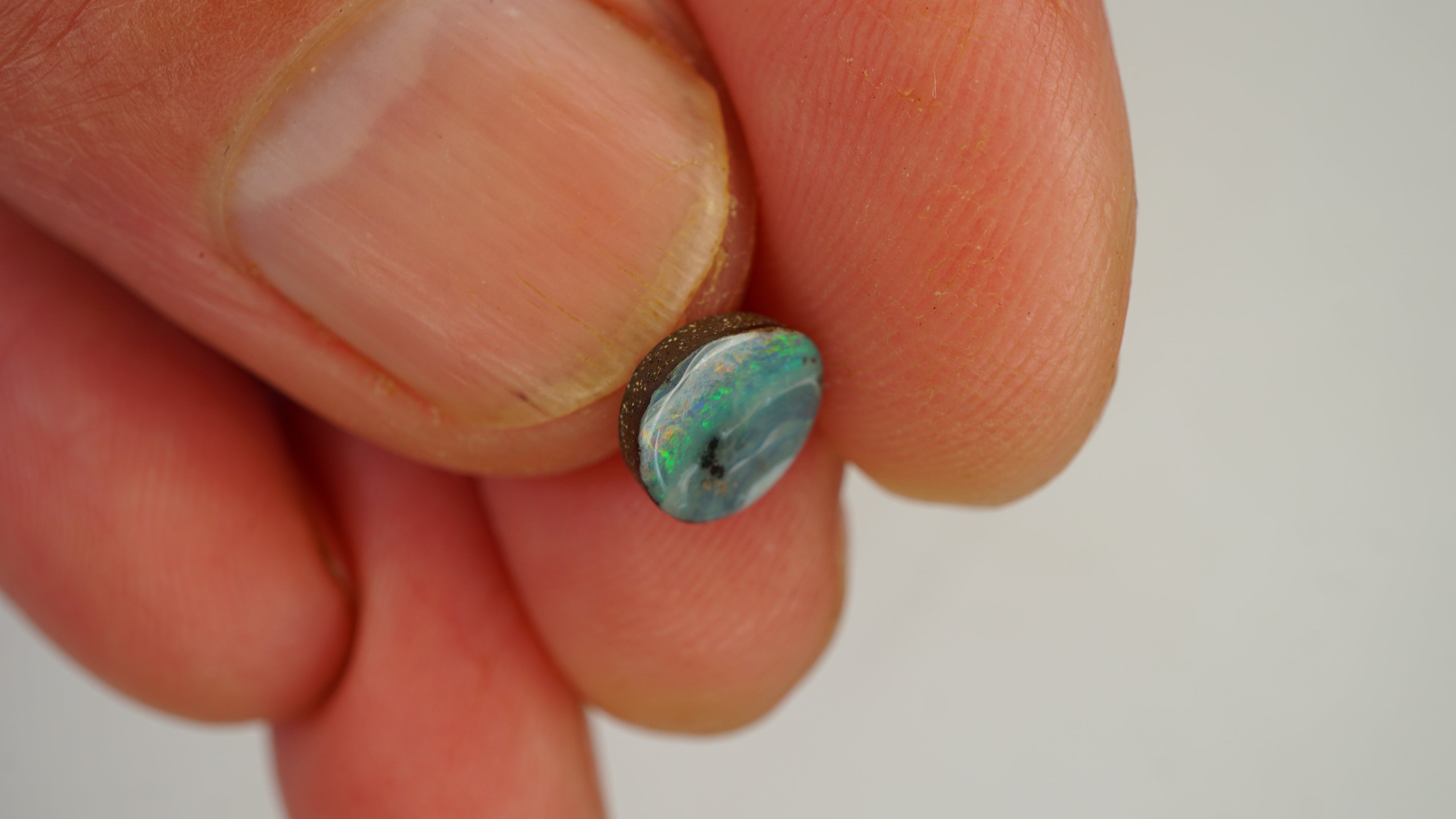 1.4ct Boulder Opal - Green & Orange Pinfire on White Base