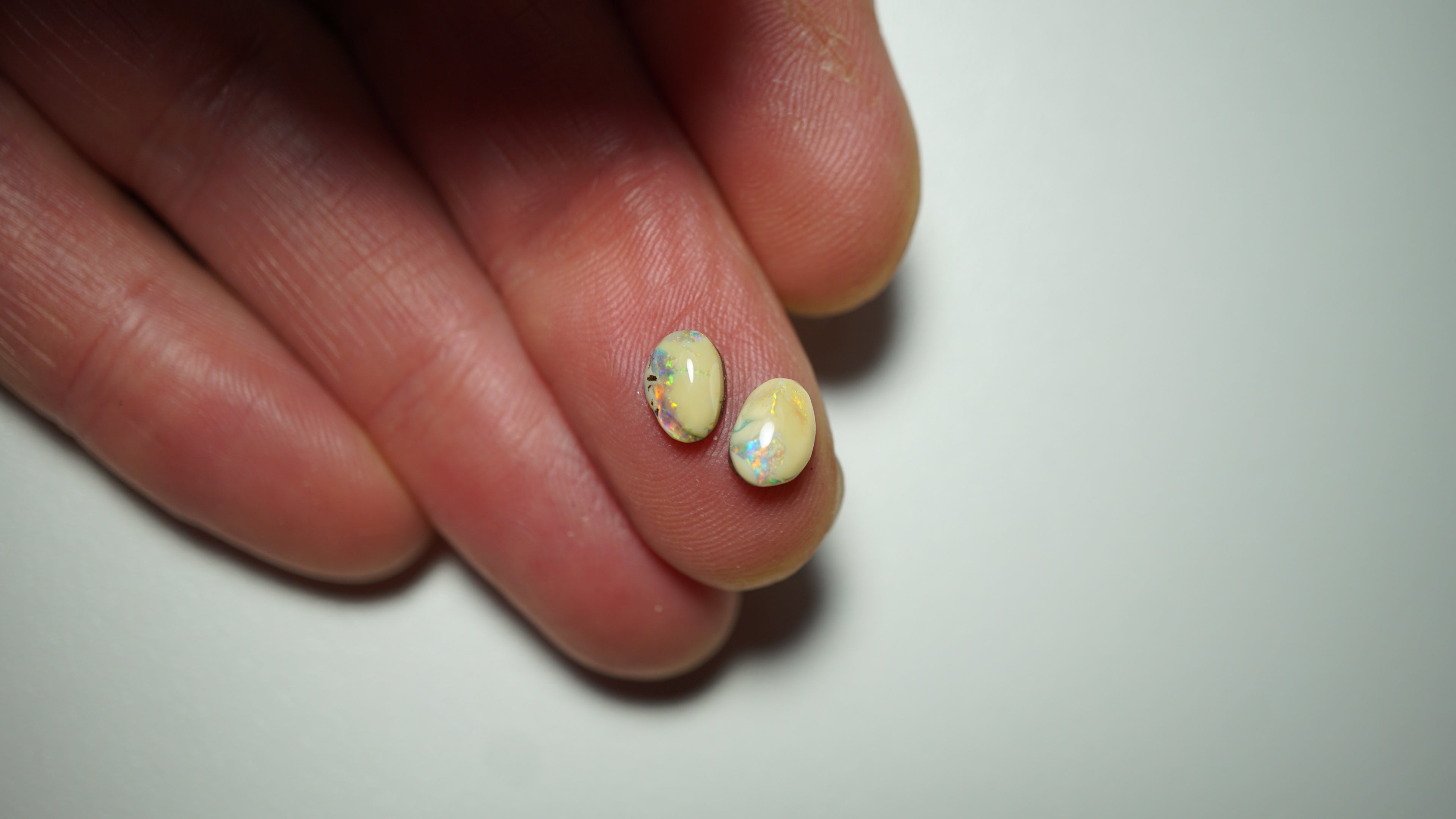 2.3ct Matched Boulder Opal Pair - Green & Aqua Play with Blue and Yellow Highlights on Brown Host Body Tone