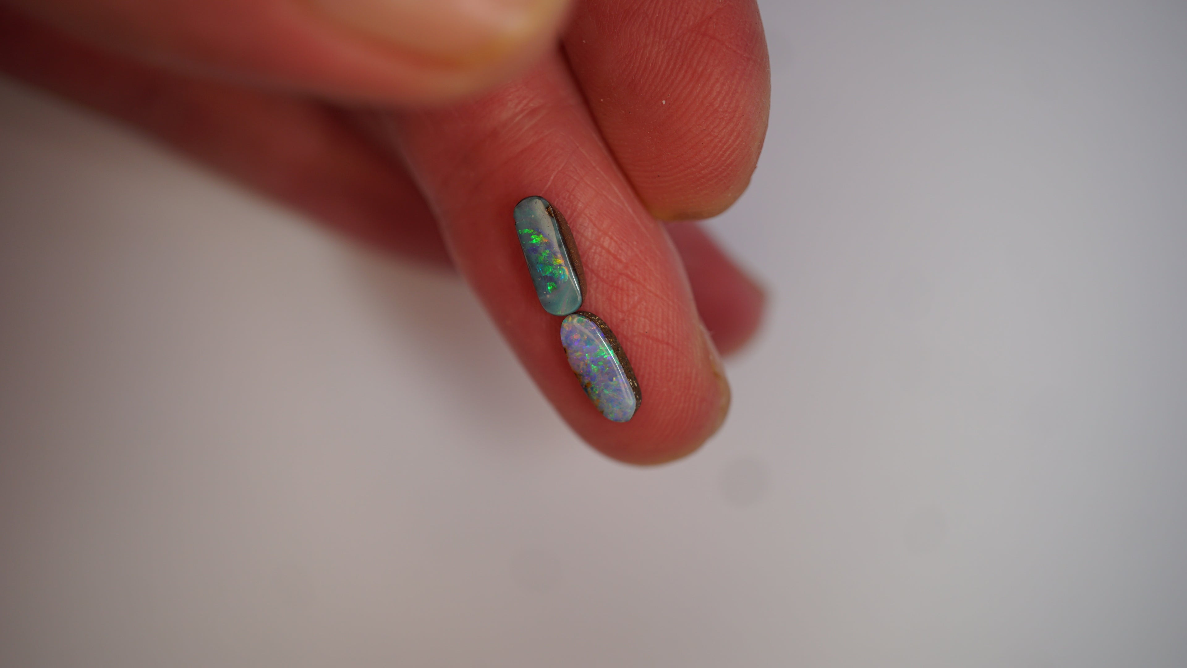 2.09ct Matched Boulder Opal Pair - Green & Violet Play on Sky Blue Host Body Tone