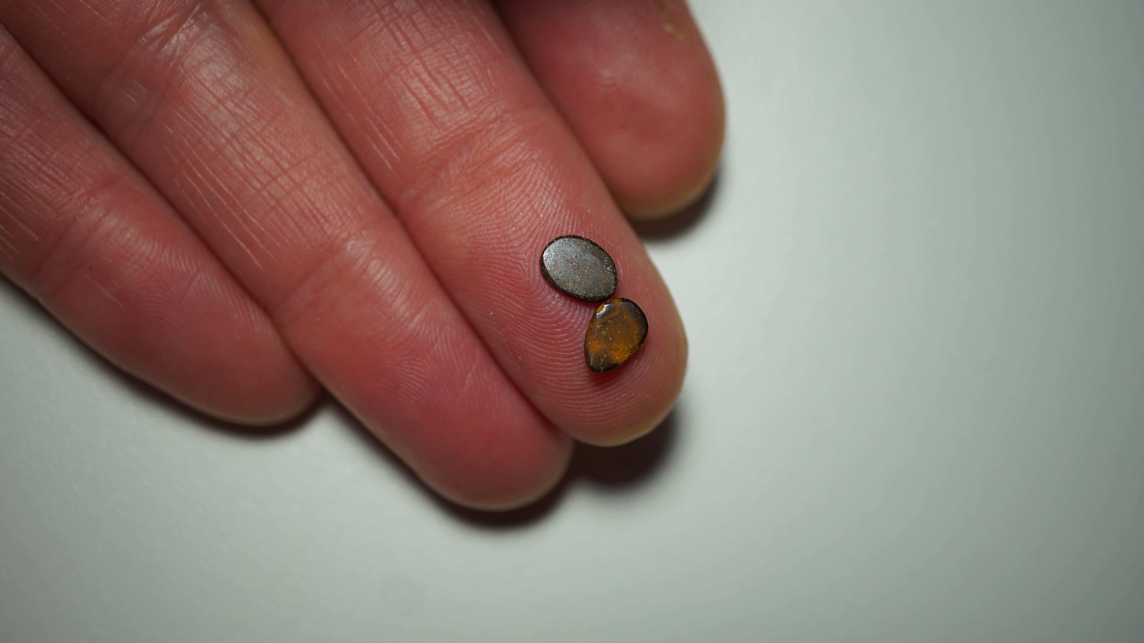 1.3ct Matched Boulder Opal Pair - Magenta & Green Pinfire on Lavender Host Body Tone