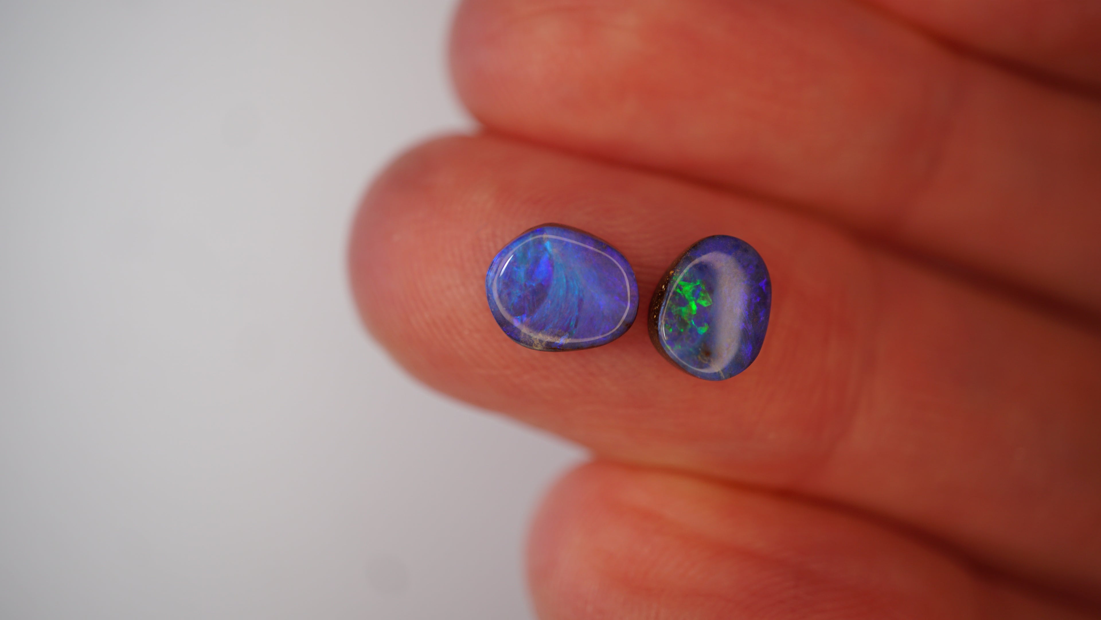 2.5ct Matched Boulder Opal Pair - Neon Green Play on Royal Blue Host Body Tone