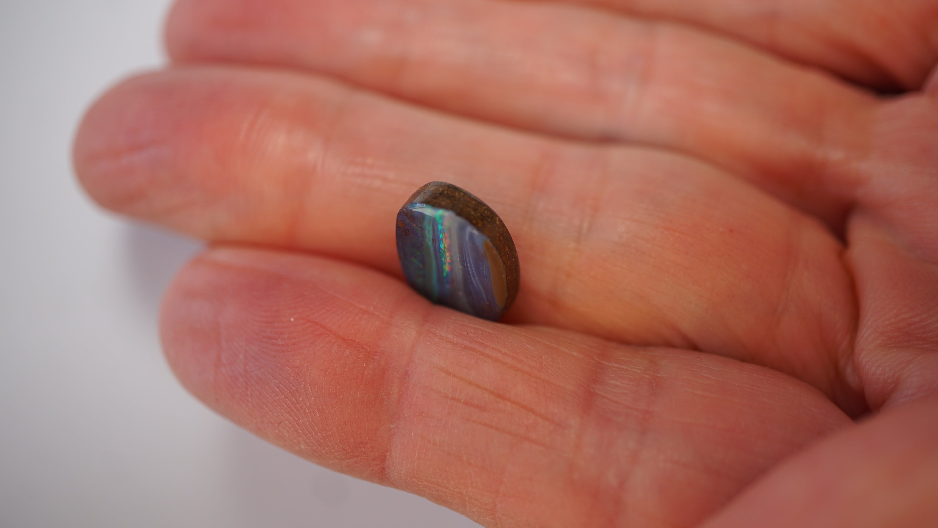 5.4ct Boulder Opal - Neon Green & Crimson Streaks on Blue Host Body Tone