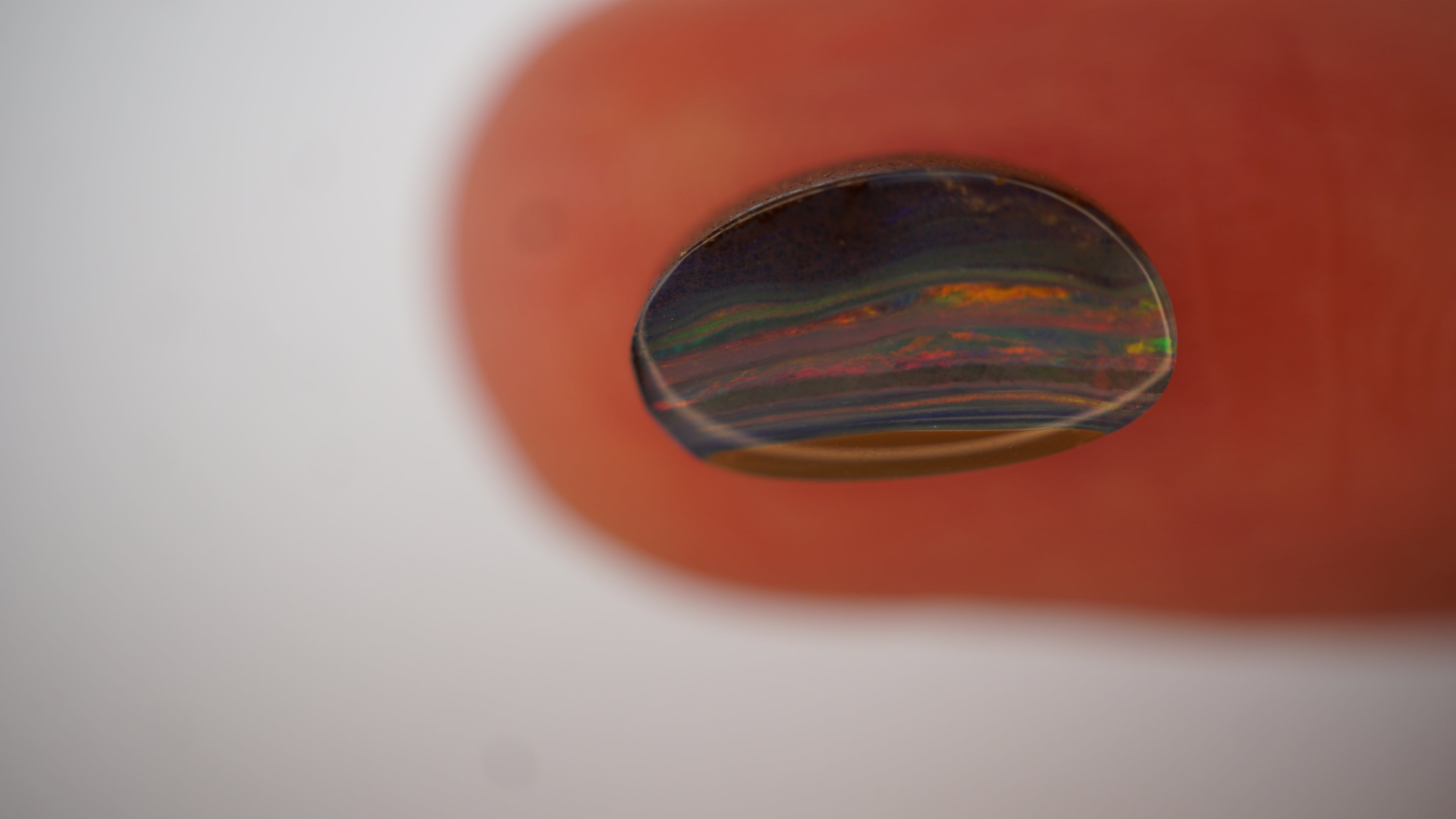 2.1ct Boulder Opal - Crimson & Green Play on Purple Host Body Tone