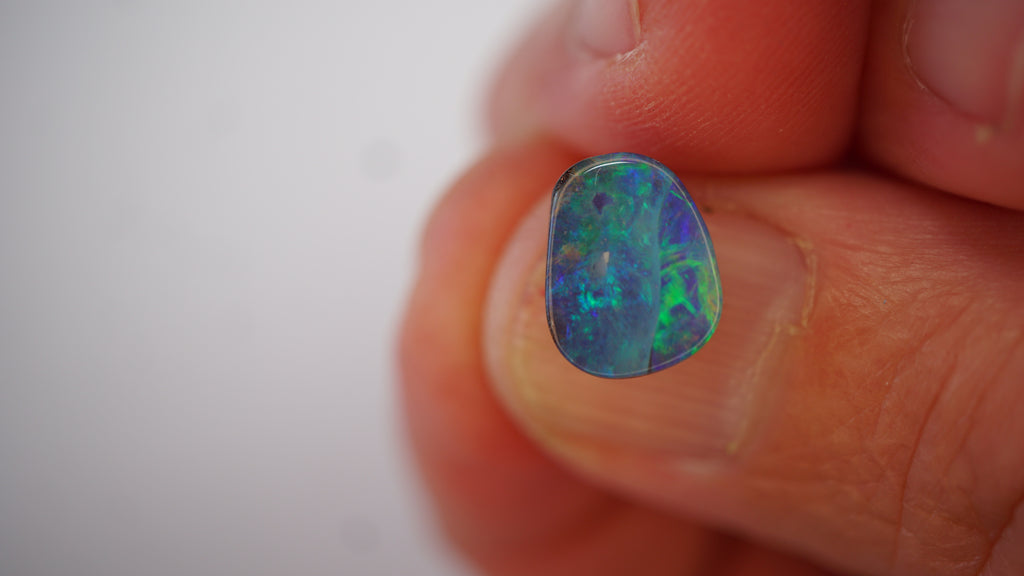 2.7ct Boulder Opal - Neon Green & Electric Blue Play on Blue Host Body Tone