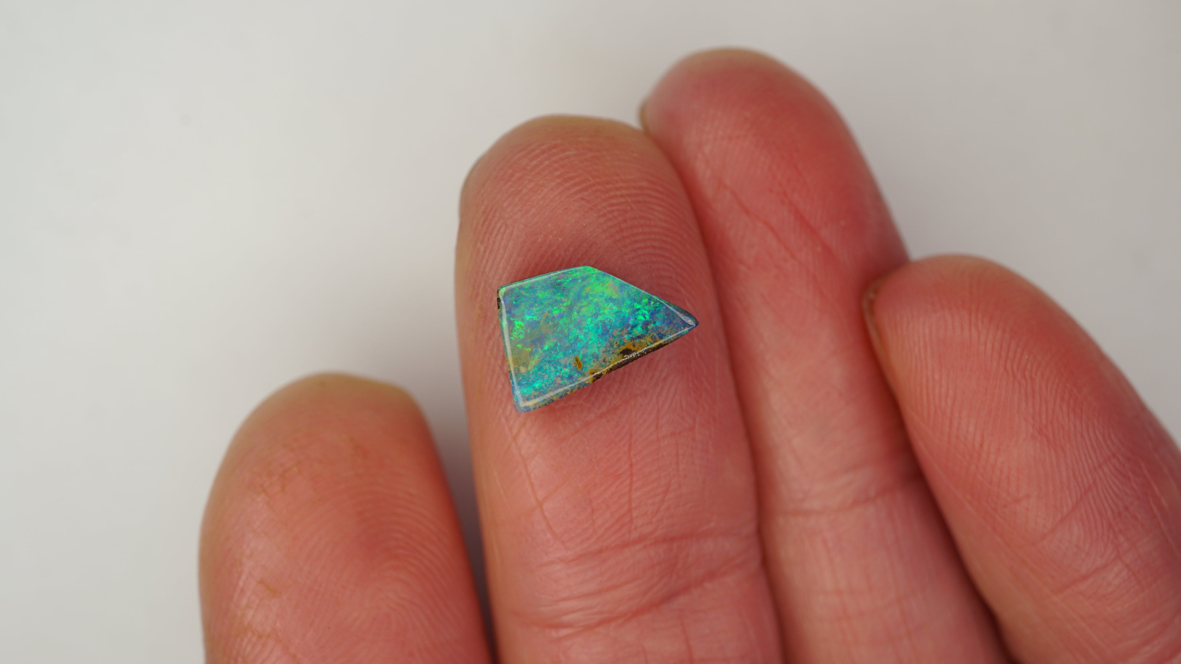 2.0ct Boulder Opal - Electric Green & Blue Pinfire on Green Host Body Tone