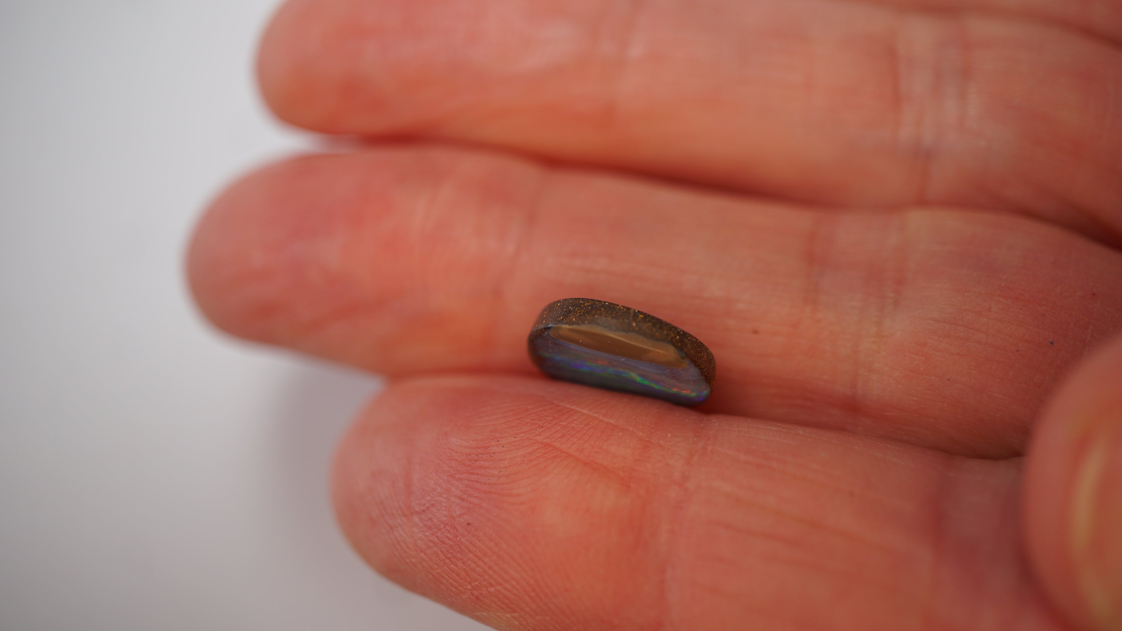 3.3ct Boulder Opal - Neon Green & Crimson Streaks on Blue Host Body Tone