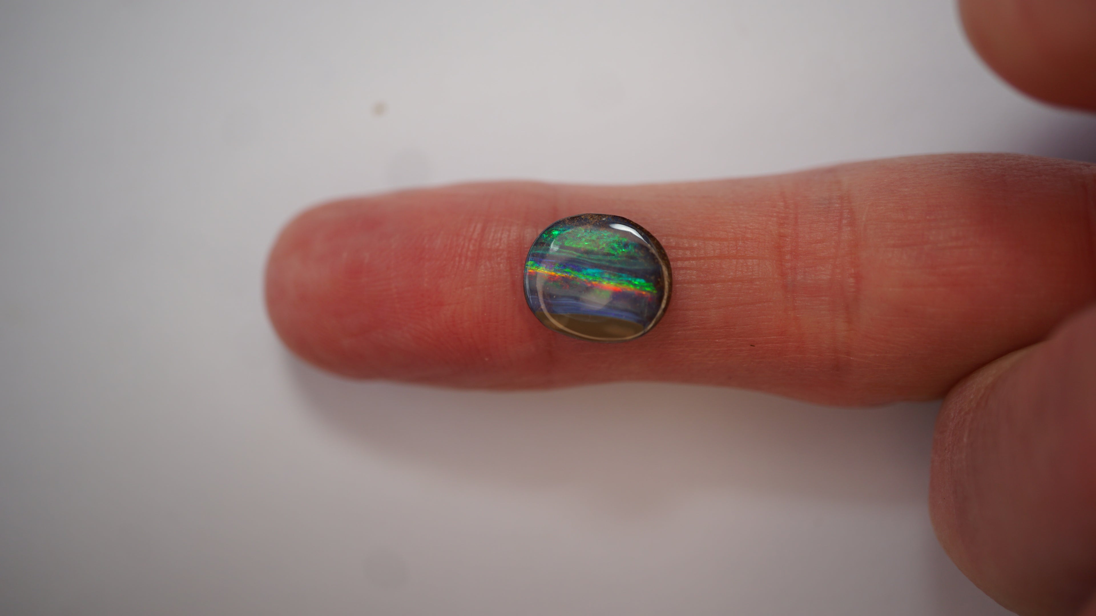 3.3ct Boulder Opal - Neon Green & Crimson Streaks on Blue Host Body Tone