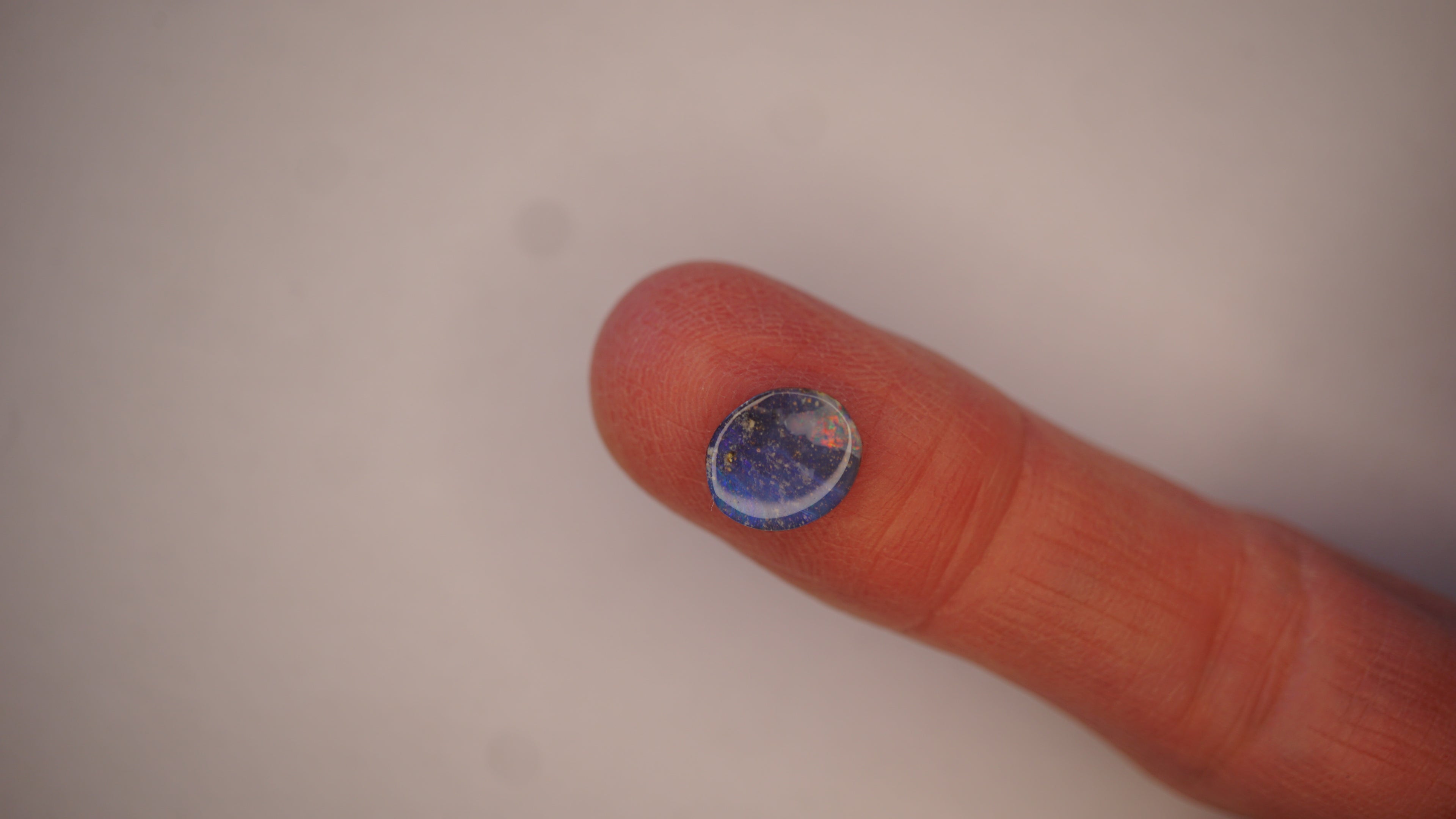 2.3ct Boulder Opal - Crimson & Green Play on Sky Blue Host Body Tone