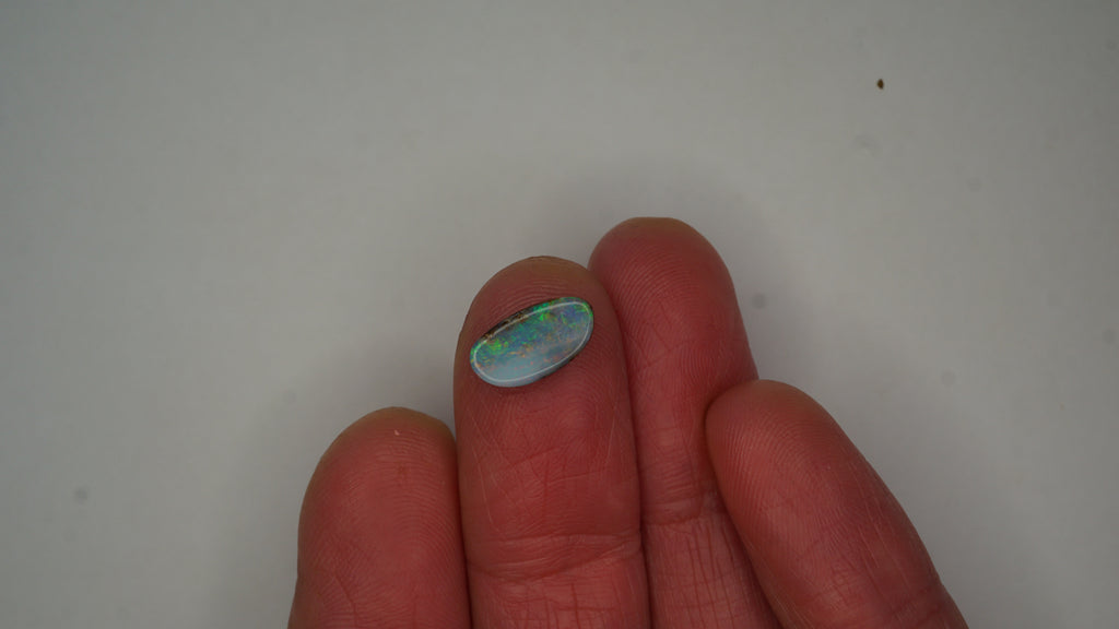 2.6ct Boulder Opal - Green, Blue & Crimson Play on Pale Purple Host Body Tone