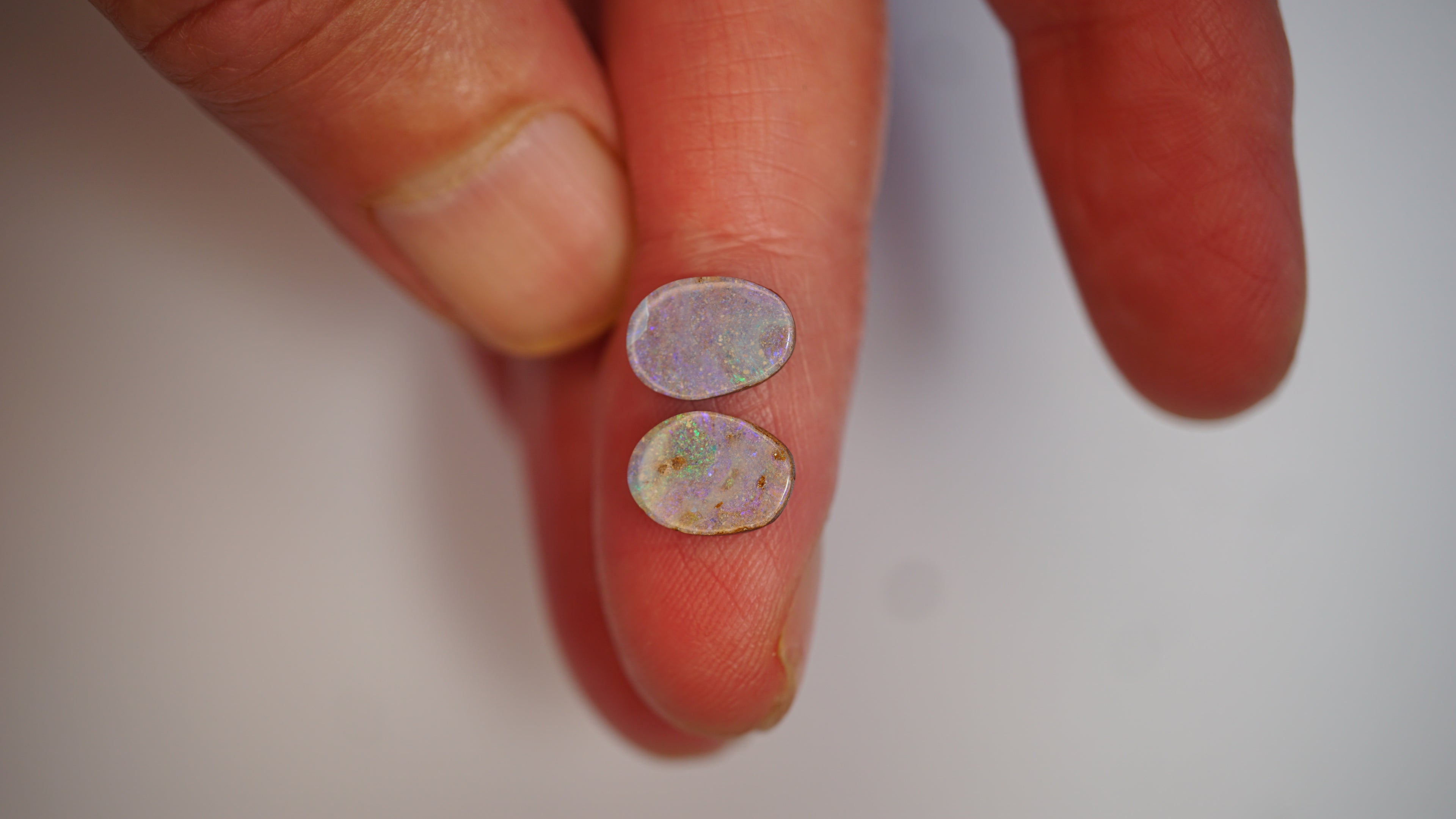 2.75ct Matched Boulder Opal Pair - Green & Magenta Pinfire on Pale Purple Host Body Tone