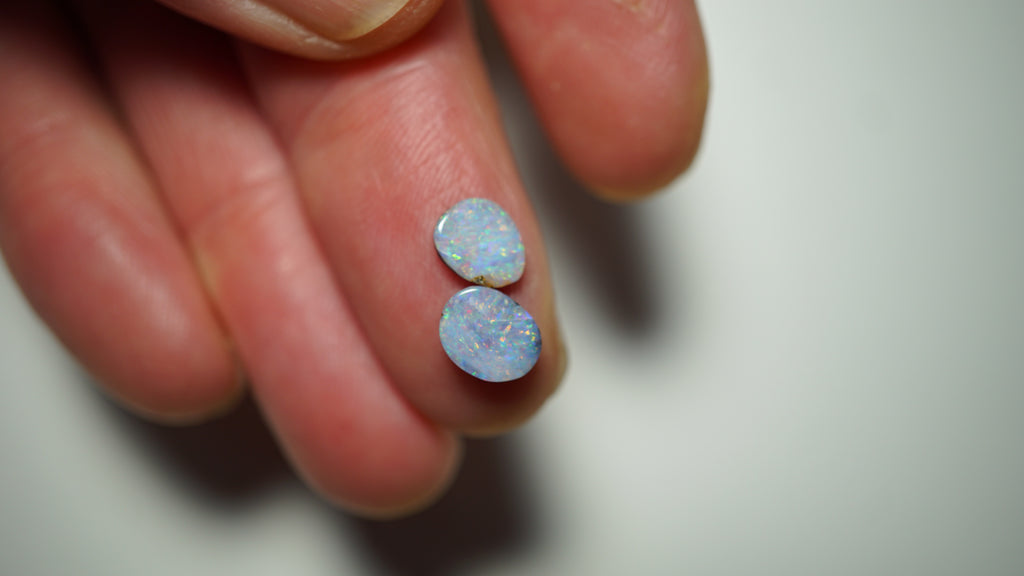 2.45ct Matched Boulder Opal Pair - Magenta & Green Pinfire on Pale Purple Host Body Tone