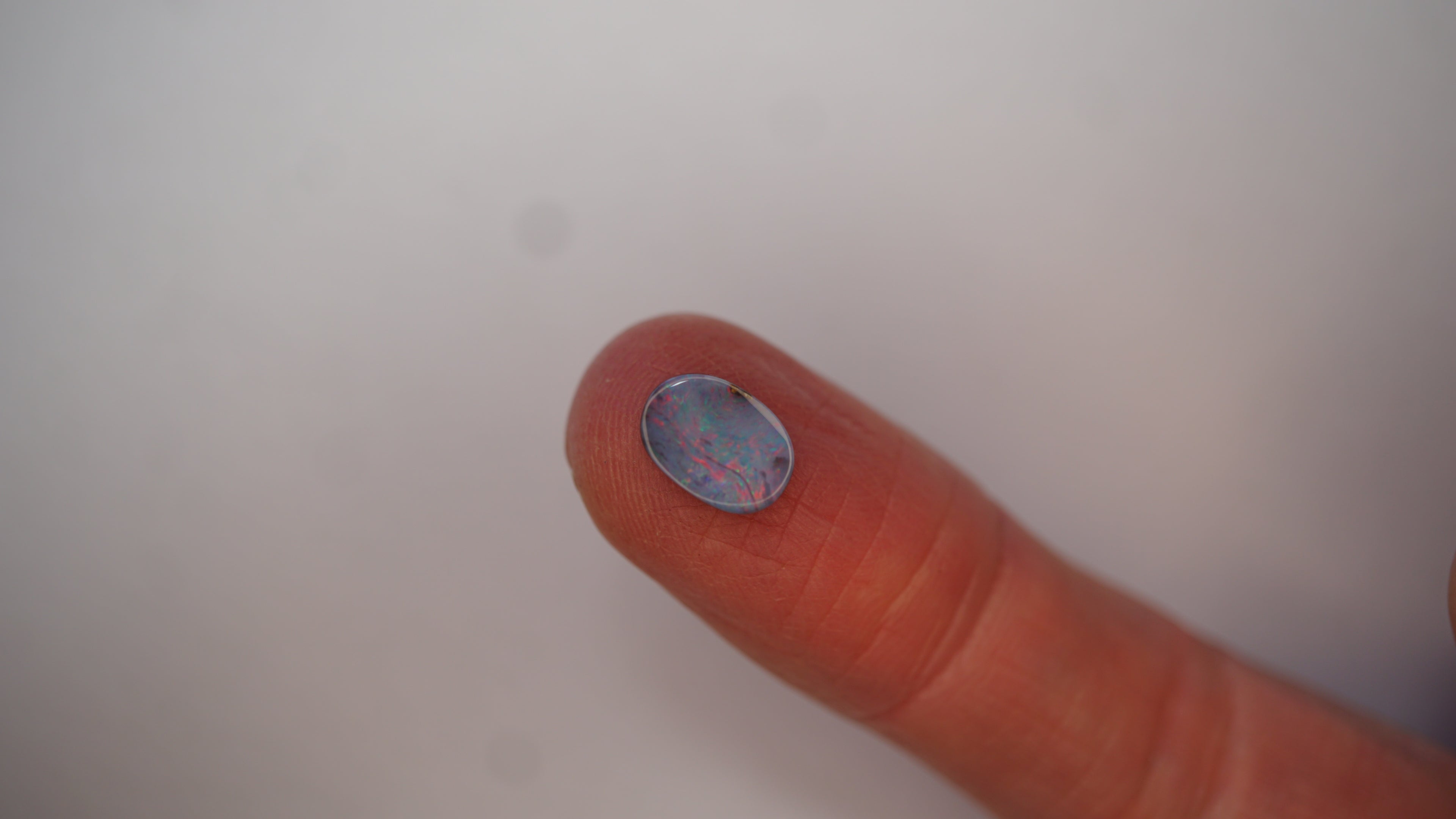 2.3ct Boulder Opal - Crimson Play on Pale Purple Host Body Tone