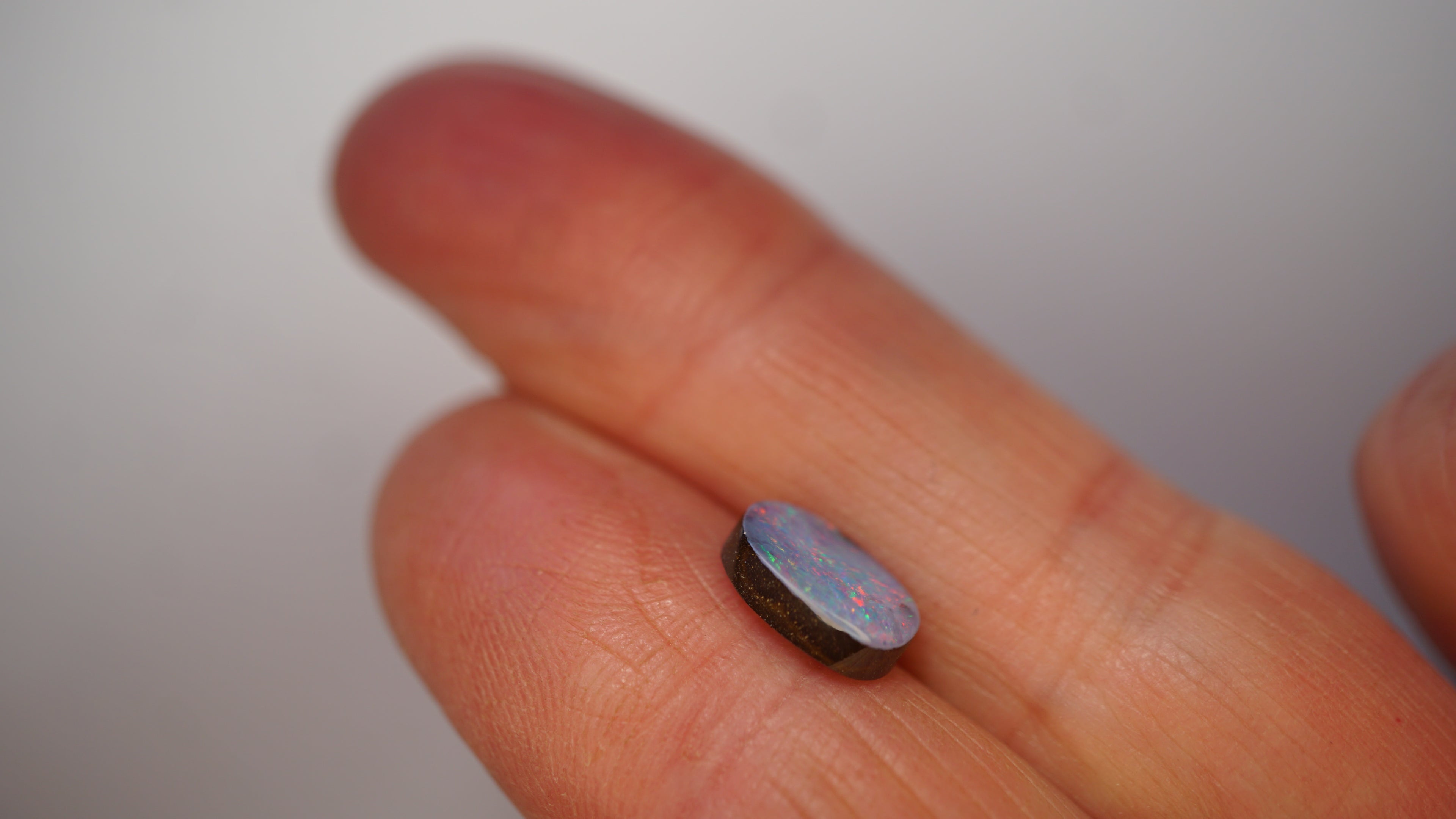 2.3ct Boulder Opal - Crimson Play on Pale Purple Host Body Tone