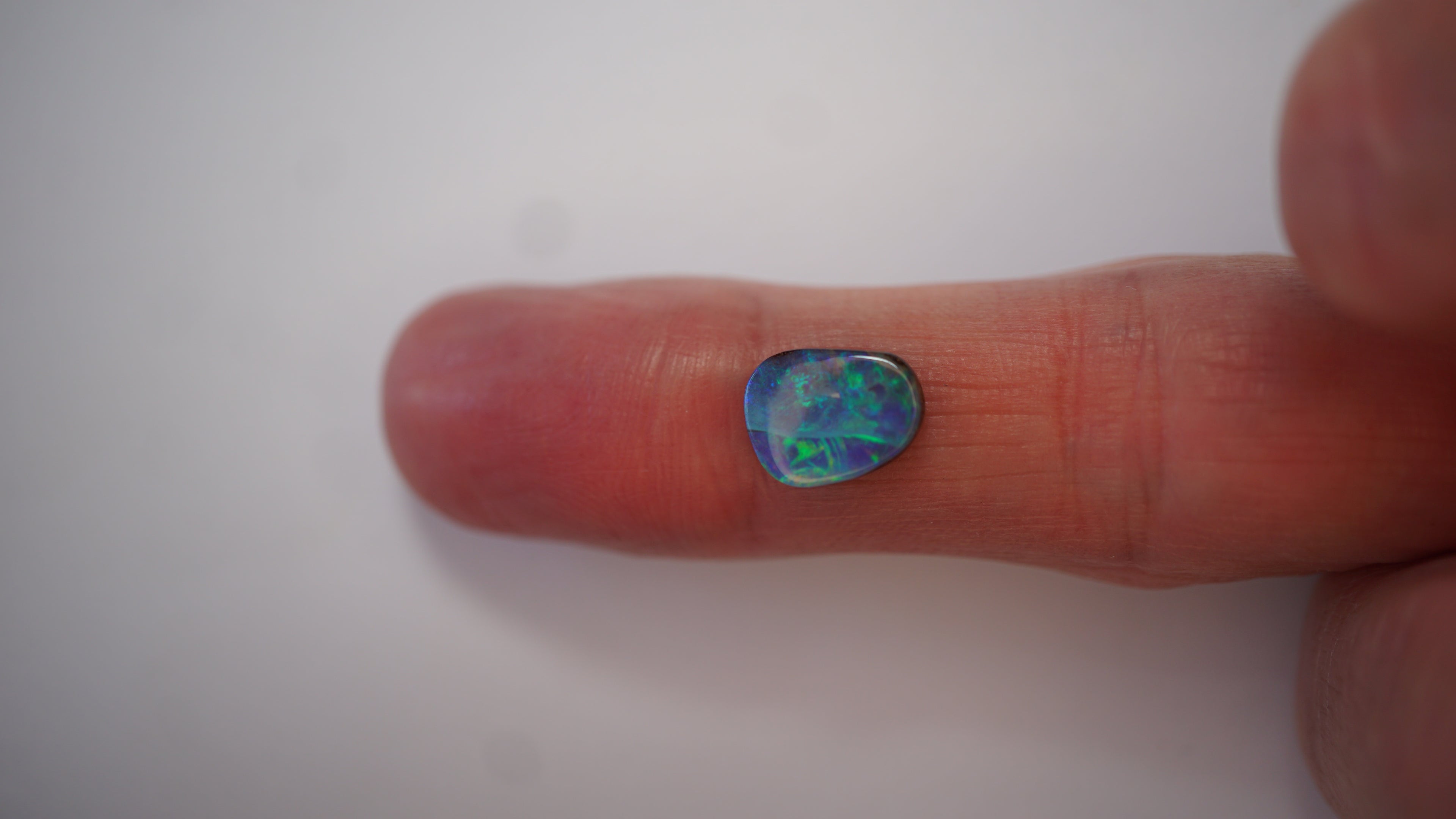2.7ct Boulder Opal - Neon Green & Electric Blue Play on Blue Host Body Tone