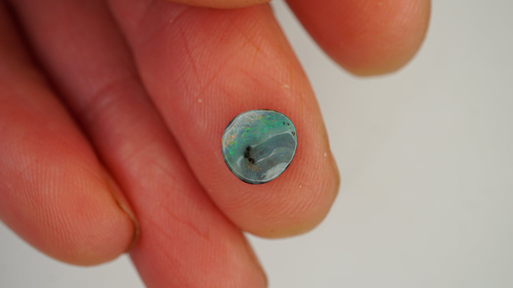 1.4ct Boulder Opal - Green & Orange Pinfire on White Base