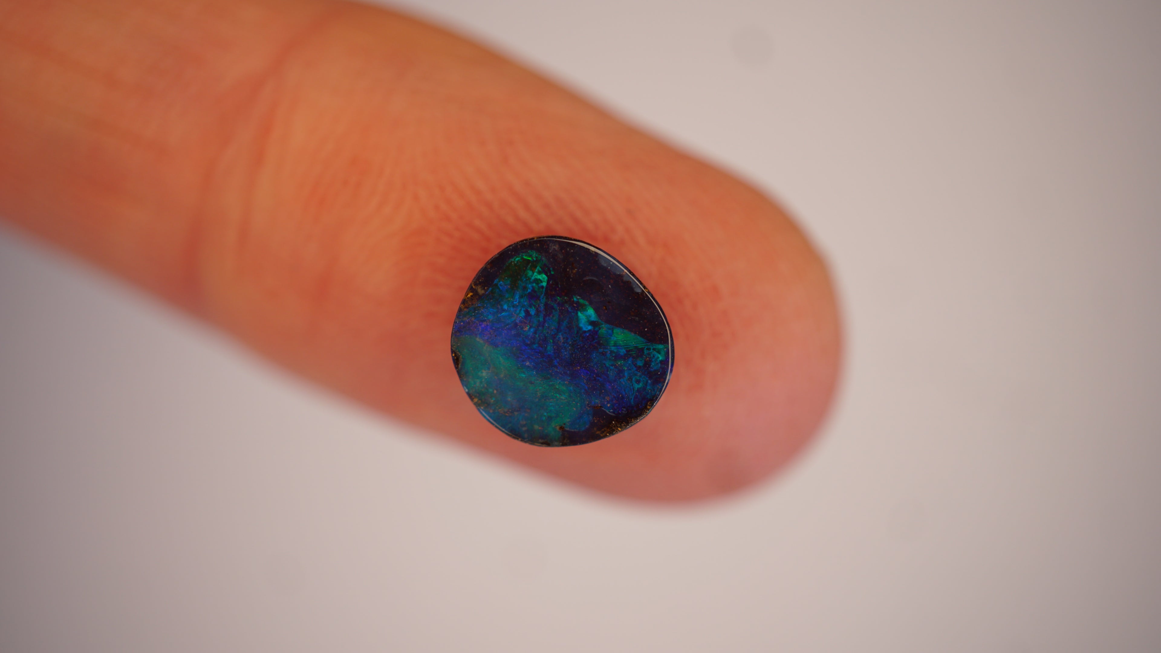 2.2ct Boulder Opal - Green Play on Deep Blue Host Body Tone