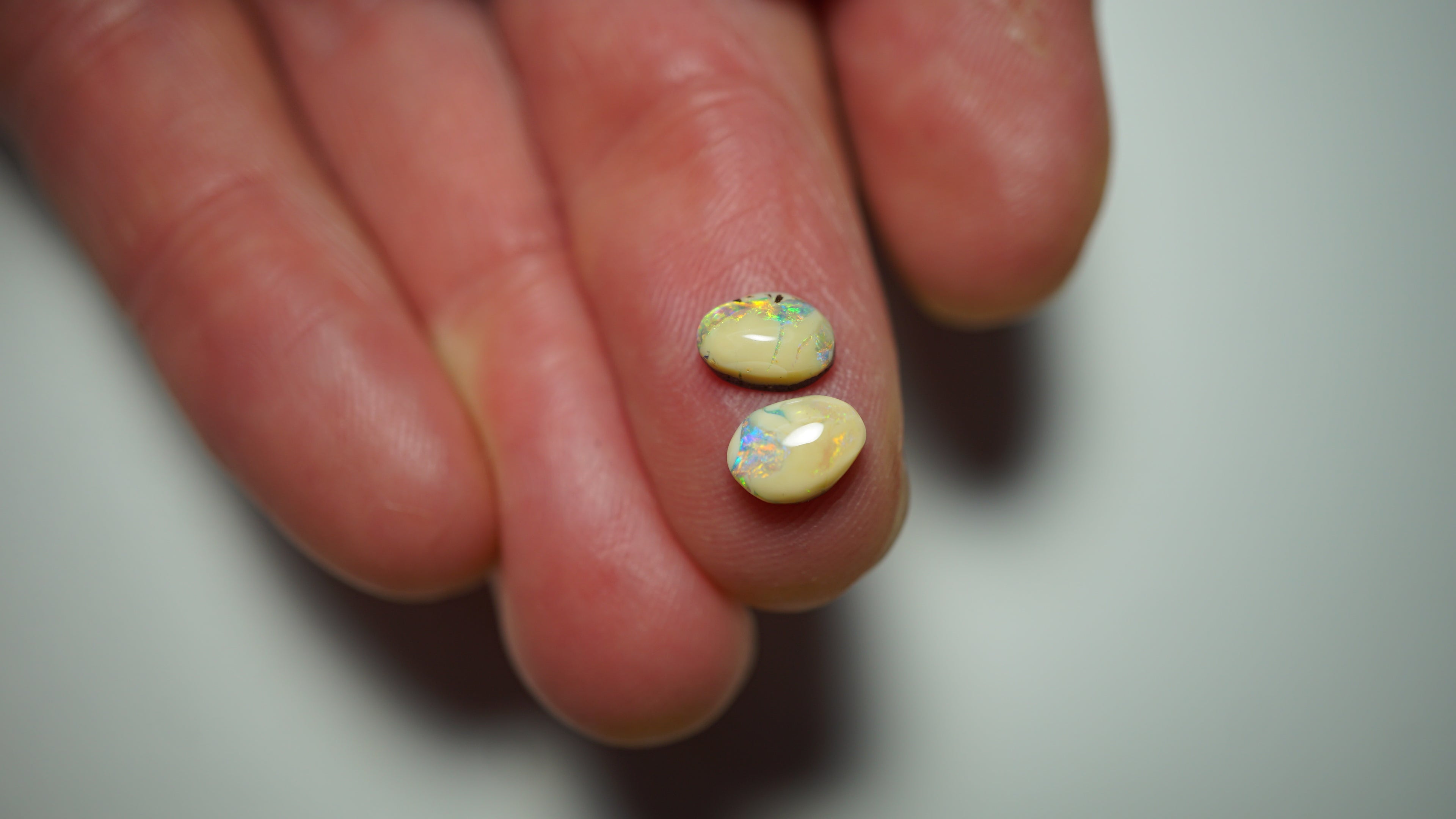 2.3ct Matched Boulder Opal Pair - Green & Aqua Play with Blue and Yellow Highlights on Brown Host Body Tone