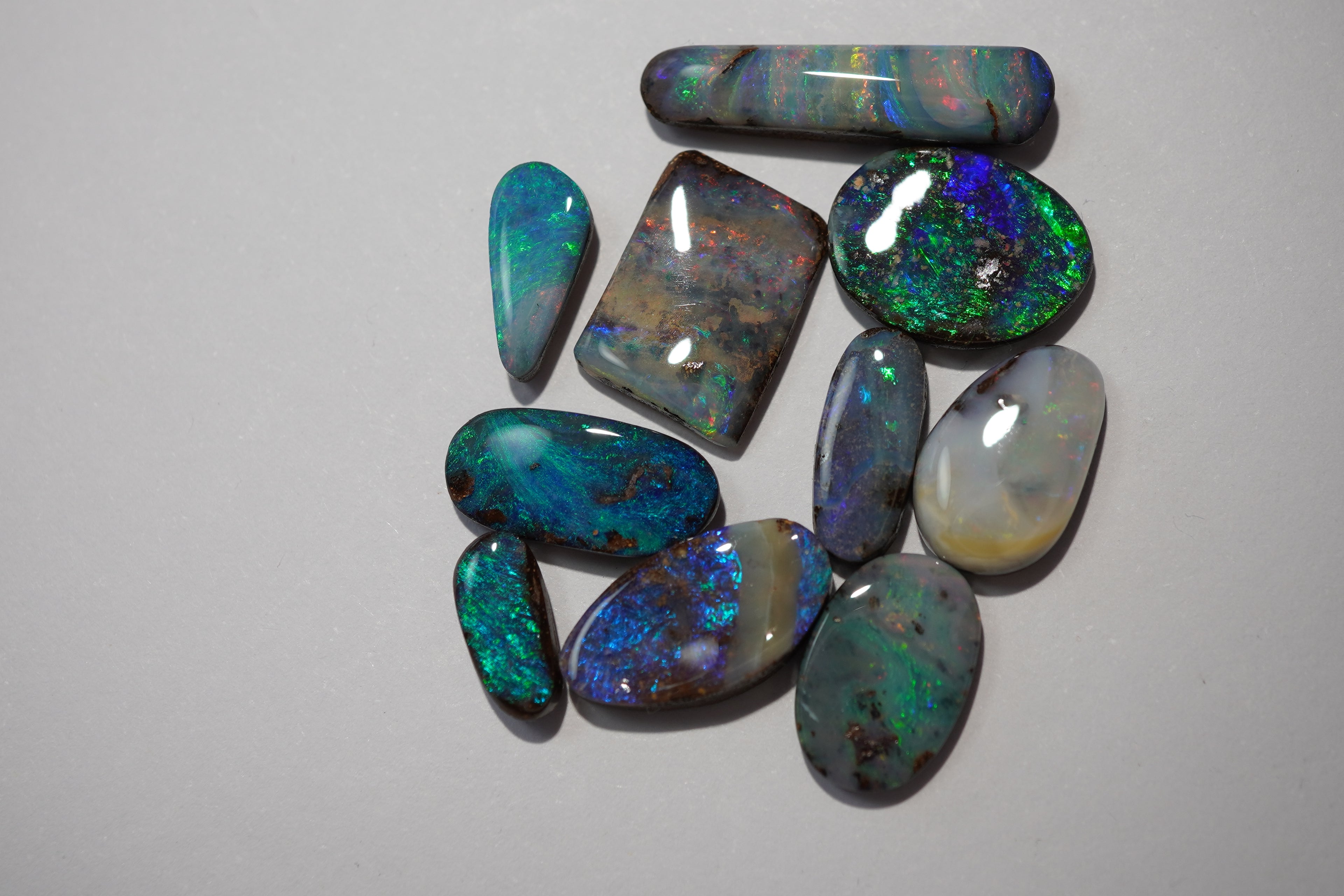 Bench Parcel - Green & Blue Selection - 10 Stone Boulder Opal Lot (22.9ct Total)