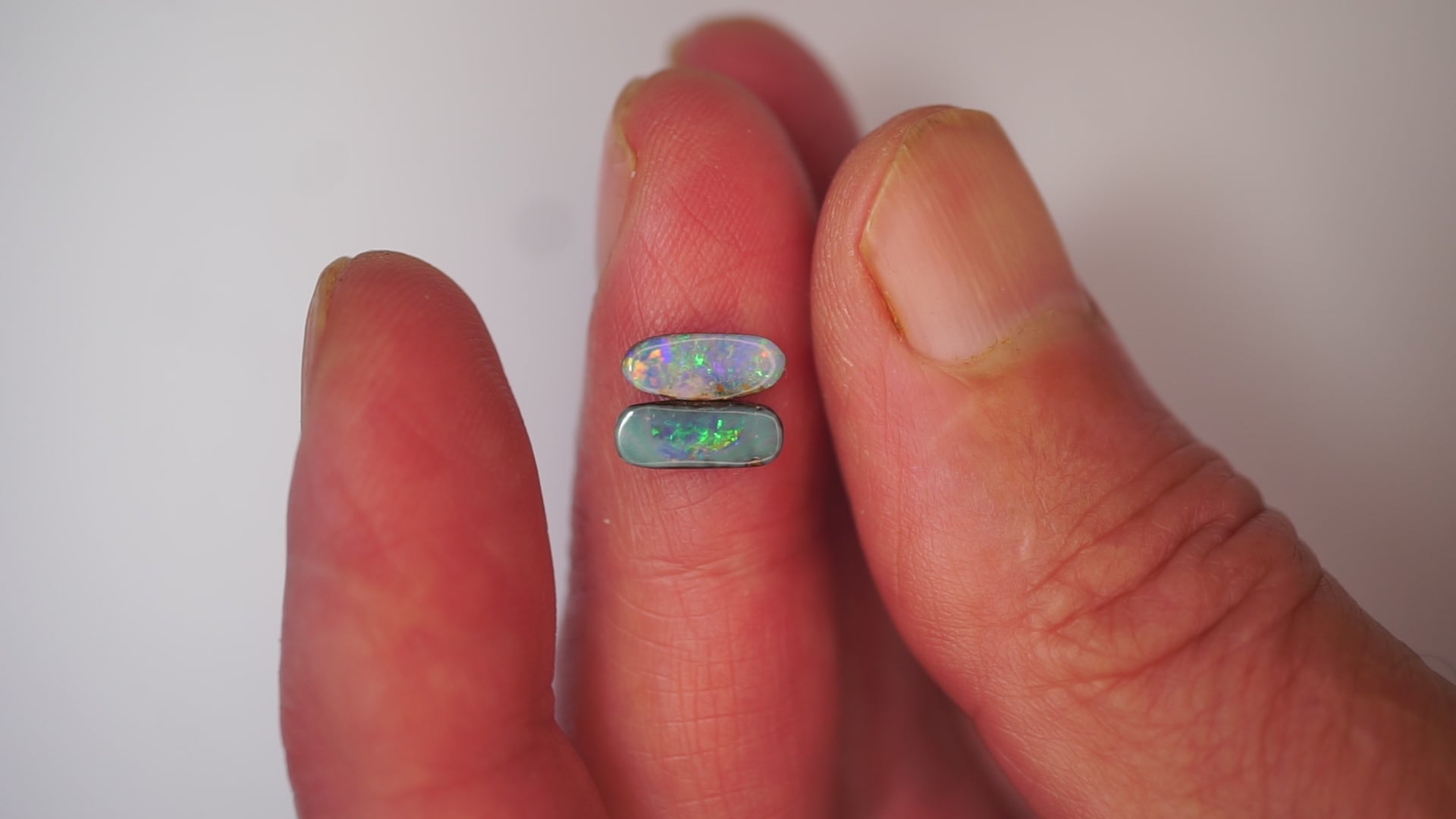 2.09ct Matched Boulder Opal Pair - Green & Violet Play on Sky Blue Host Body Tone
