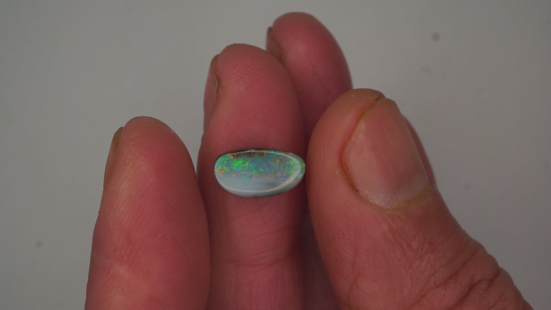 2.6ct Boulder Opal - Green, Blue & Crimson Play on Pale Purple Host Body Tone