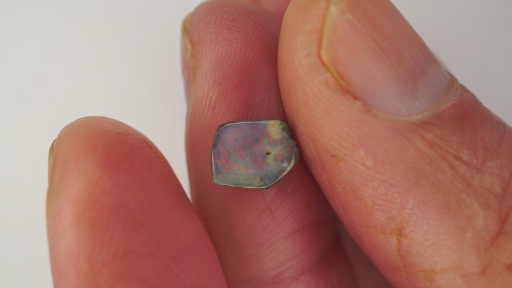 1.6ct Pentagonal Boulder Opal - Red Pinfire on Light Purple Base
